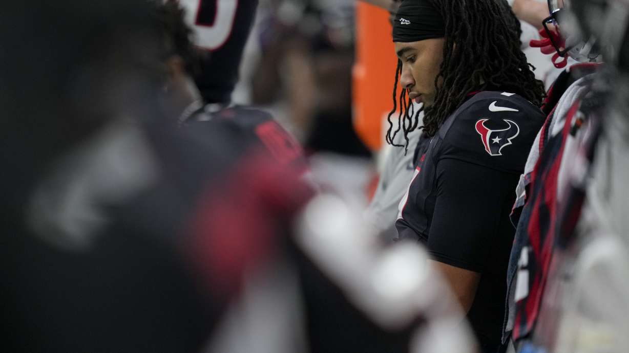 Houston Texans quarterback C.J. Stroud sits on the bench late in the second half an NFL football game against the Tennessee Titans, Sunday, Nov. 24, 2024, in Houston.