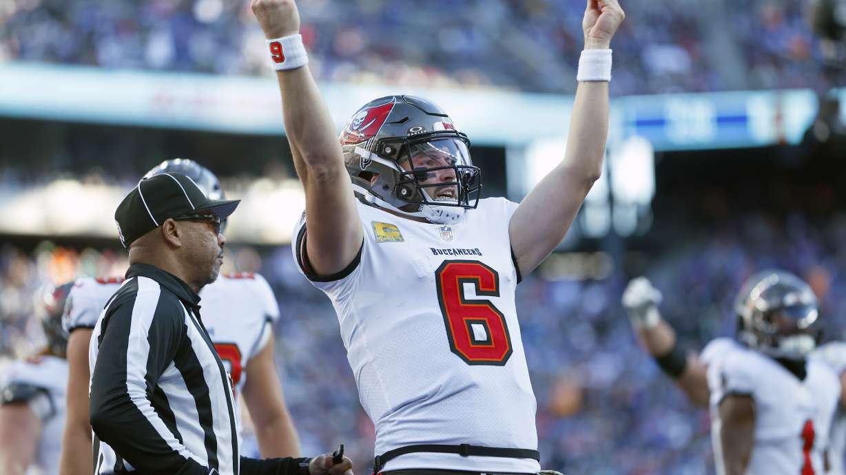 Tampa Bay Buccaneers quarterback Baker Mayfield (6) celebrates his touchdown run against the New York Giants during the first half of an NFL football game Sunday, Nov. 24, 2024, in East Rutherford, N.J.