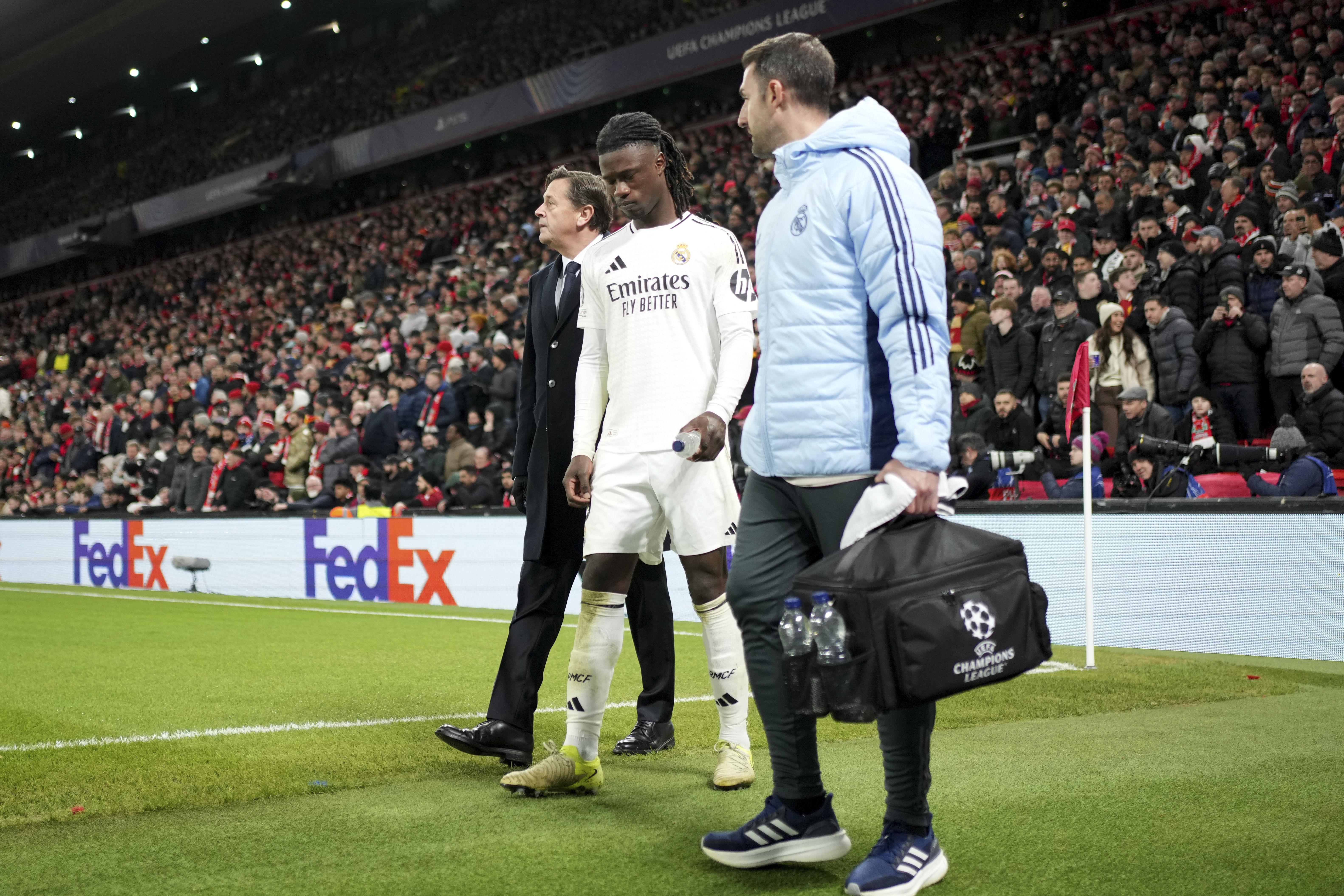 Real Madrid's Eduardo Camavinga leaves the pitch after getting injured during the Champions League opening phase soccer match between Liverpool and Real Madrid at Anfield Stadium, Liverpool, England, Wednesday, Nov. 27, 2024.