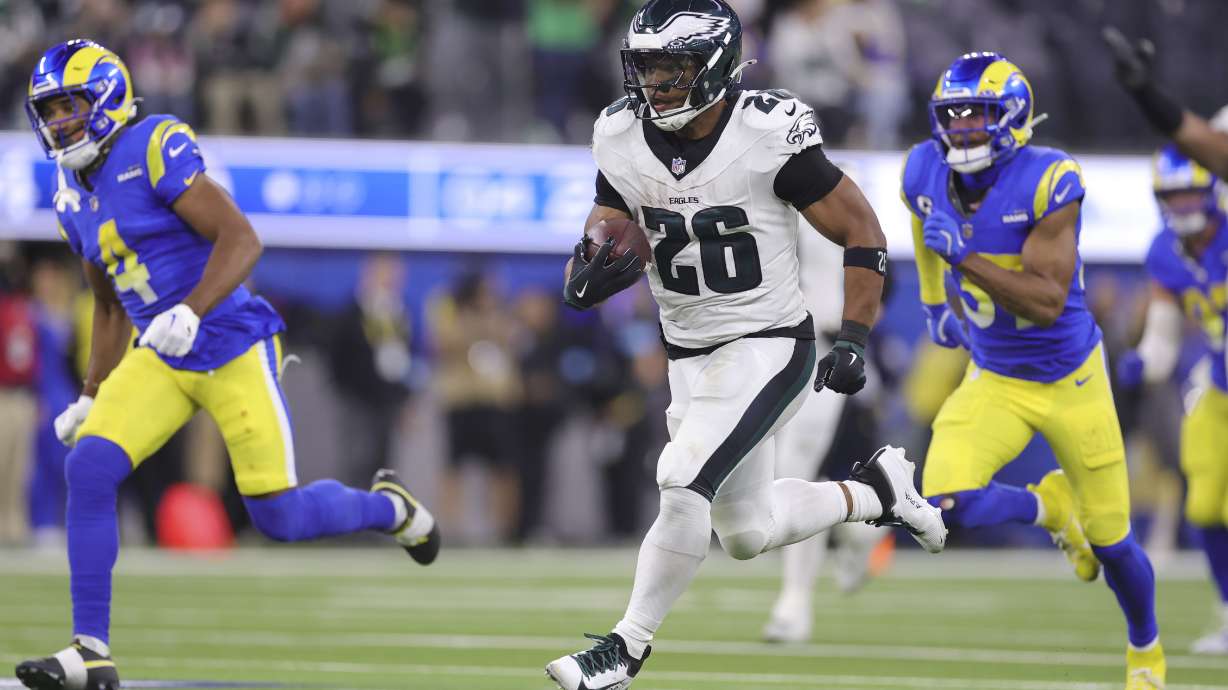 Philadelphia Eagles running back Saquon Barkley (26) runs for a touchdown against the Los Angeles Rams during the second half of an NFL football game in Inglewood, Calif., Sunday, Nov. 24, 2024.