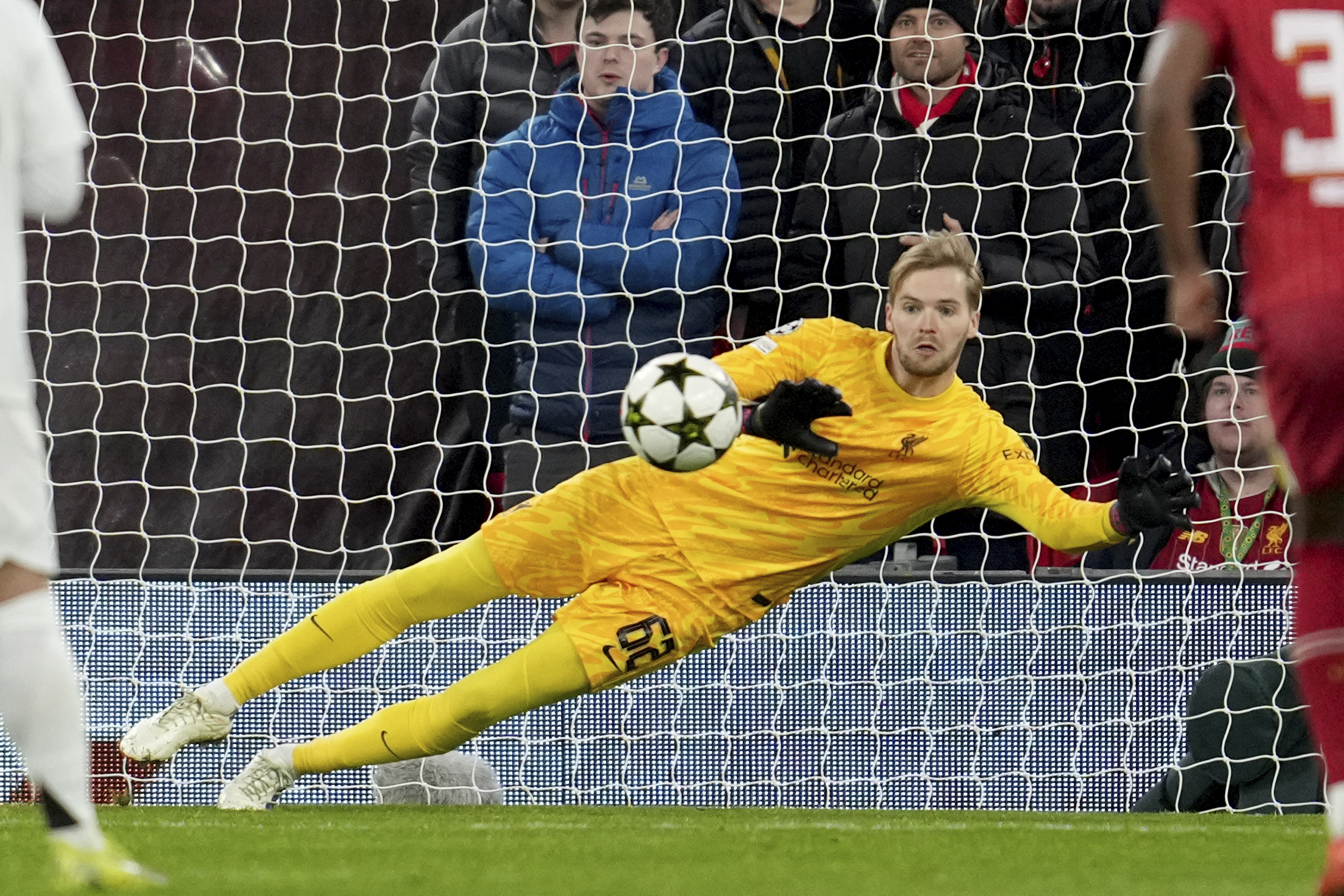Liverpool's goalkeeper Caoimhin Kelleher stops a penalty shot from Real Madrid's Kylian Mbappe during the Champions League opening phase soccer match between Liverpool and Real Madrid at Anfield Stadium, Liverpool, England, Wednesday, Nov. 27, 2024. 