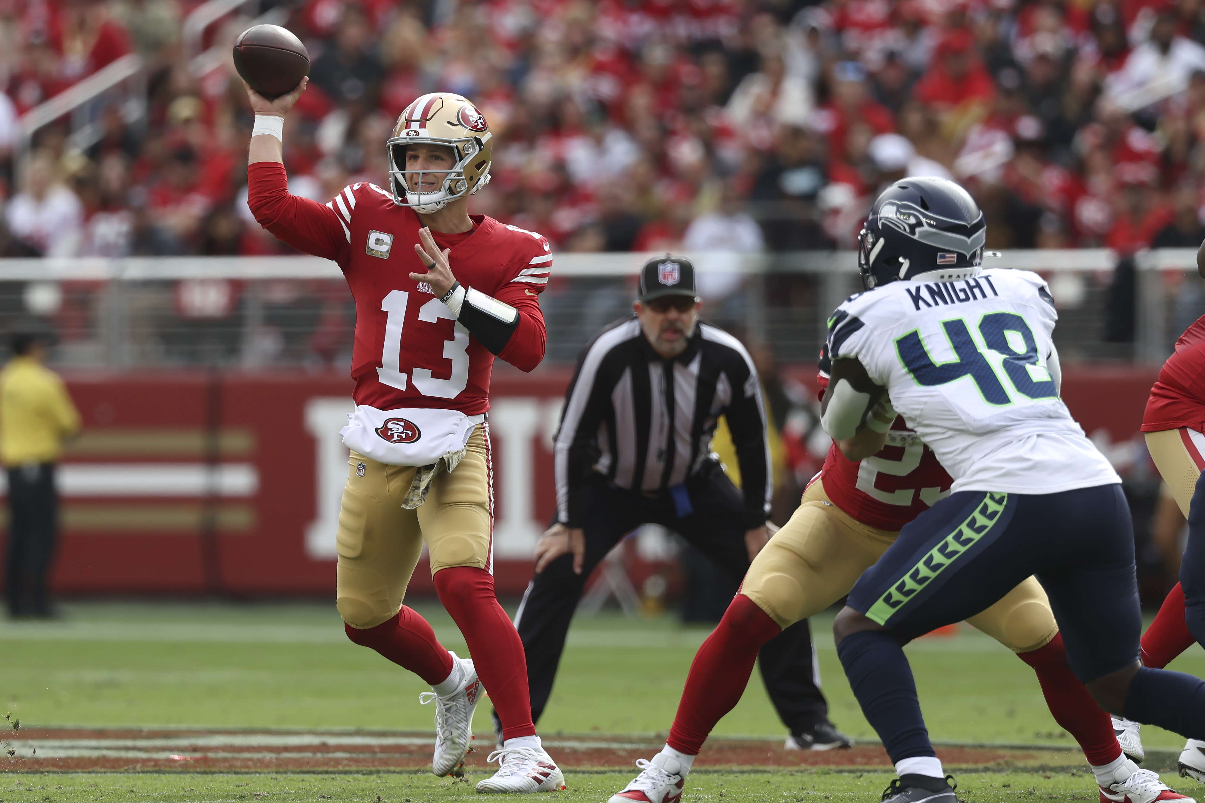 San Francisco 49ers quarterback Brock Purdy (13) passes against the Seattle Seahawks during the first half of an NFL football game in Santa Clara, Calif., Sunday, Nov. 17, 2024. 