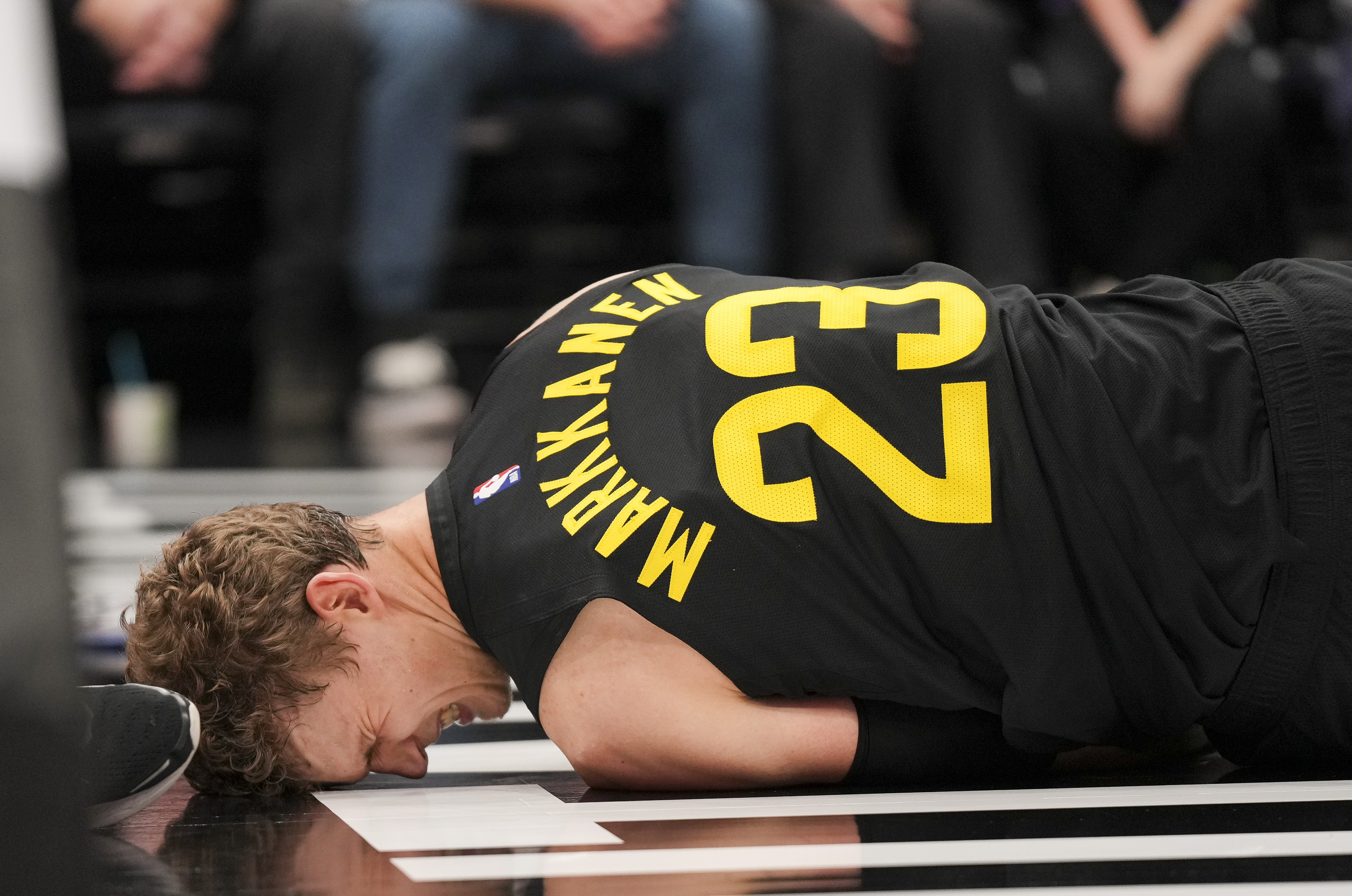 Utah Jazz forward Lauri Markkanen (23) reacts to an injury during the second half of an NBA basketball game against the San Antonio Spurs, on Tuesday, Nov. 26, 2024, in Salt Lake City. 