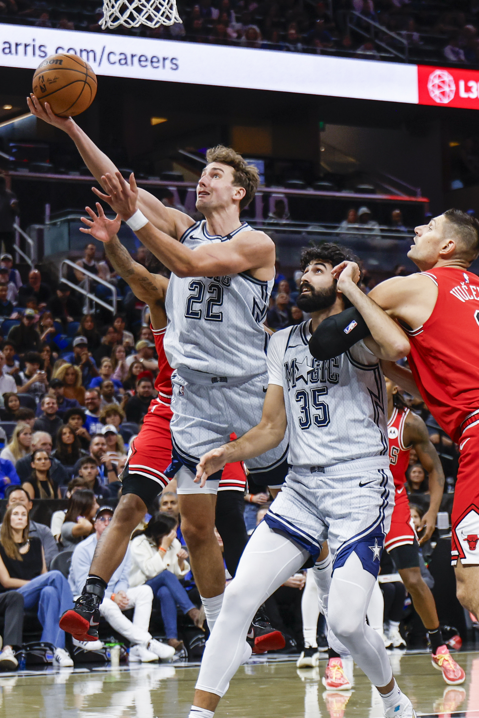Orlando Magic forward Franz Wagner (22) breaks to the basket through teammates and Chicago Bulls during the first half of an NBA basketball game, Wednesday, Nov. 27, 2024, in Orlando, Fla. 