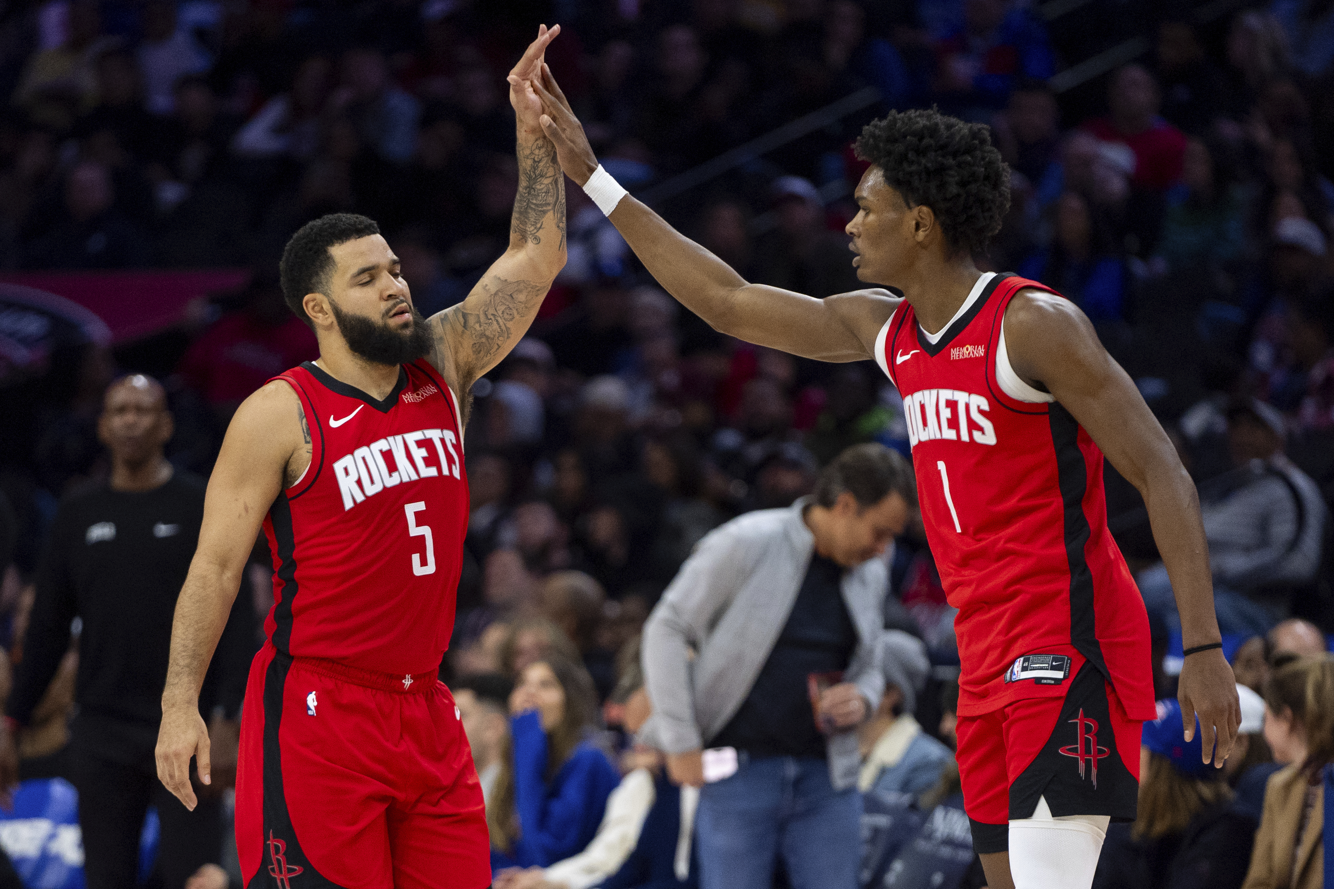 Houston Rockets' Fred VanVleet, left, celebrates his three-point shot with Amen Thompson, right, during the first half of an NBA basketball game against the Philadelphia 76ers, Wednesday, Nov. 27, 2024, in Philadelphia.
