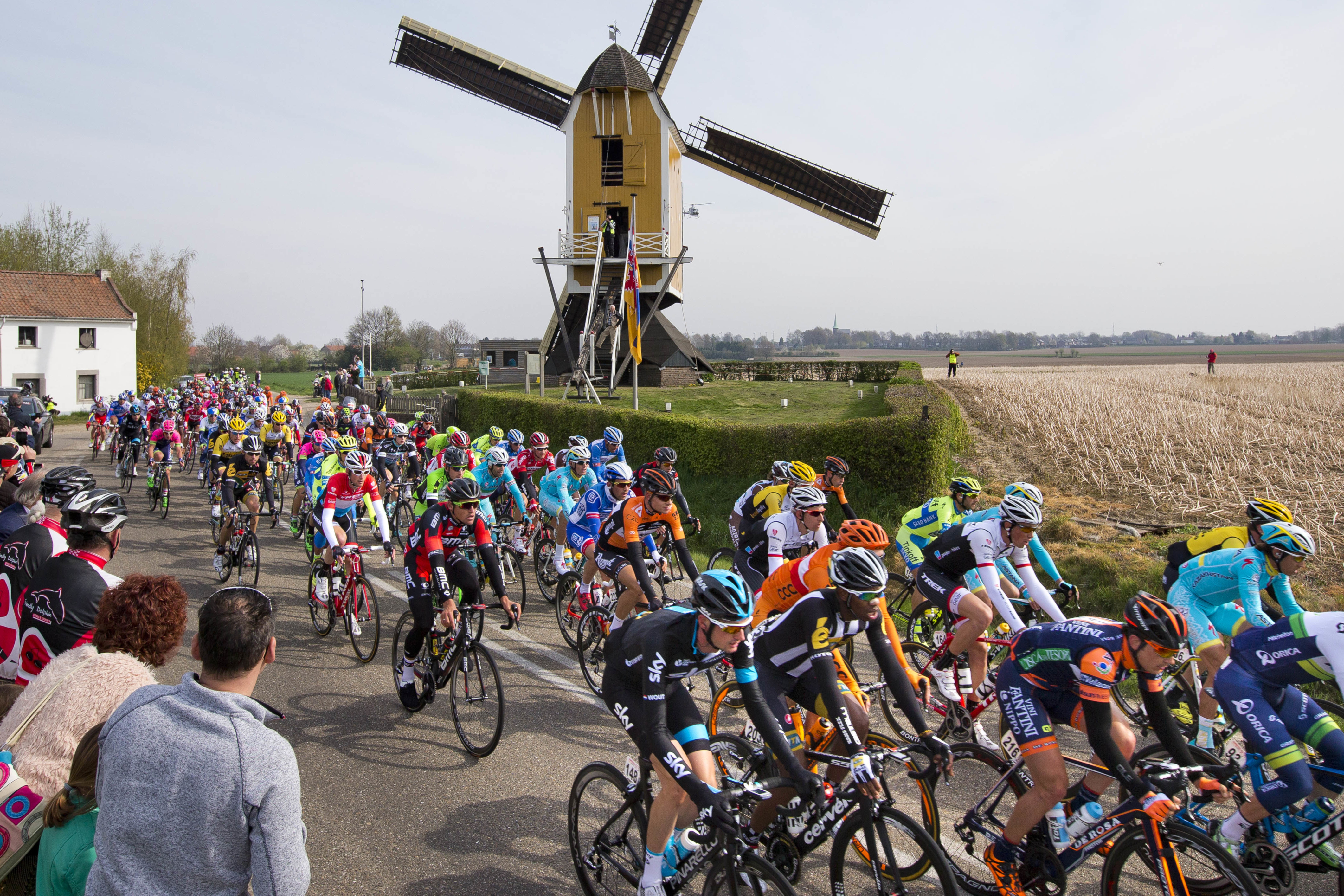 FILE - The pack passes a windmill near the village of Beek during the 50th edition of the Amstel Gold cycling race over 258 kilometers (160 miles) with start in Maastricht and finish in Valkenburg, southern Netherlands, Sunday, April 19, 2015. 