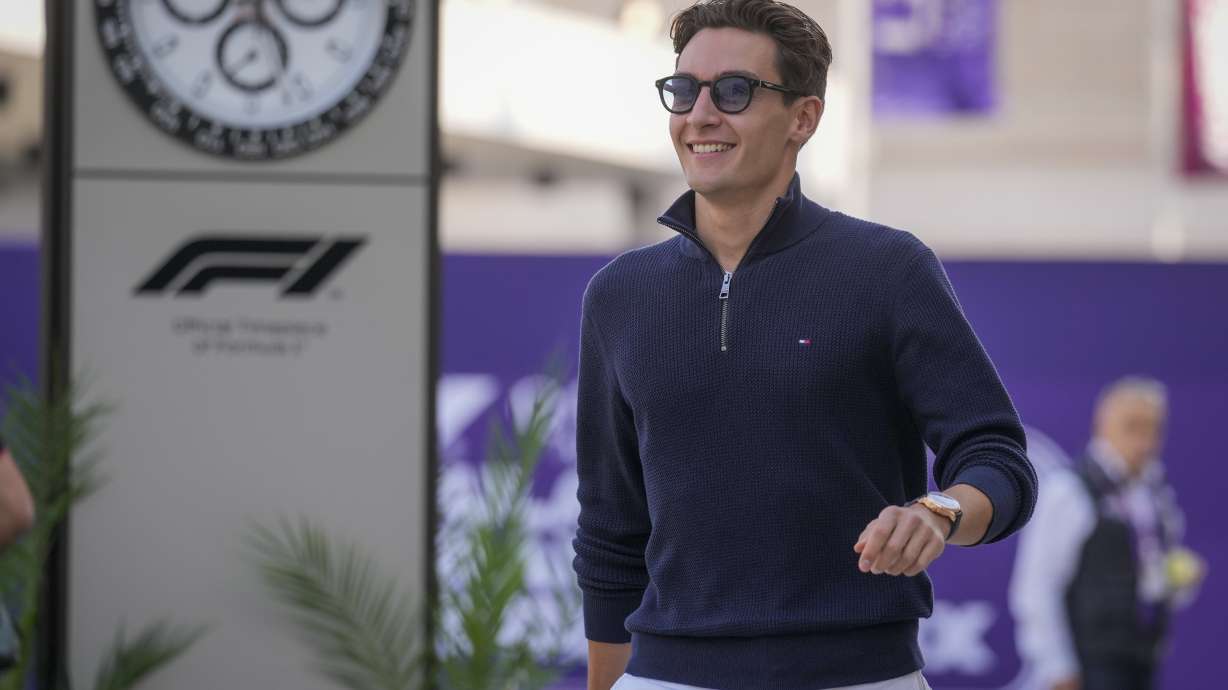 Mercedes driver George Russell of Britain walks through paddock as he arrives at the Lusail International Circuit in Lusail, Qatar, ahead of the Qatar Grand Prix, Thursday, Nov. 28, 2024.