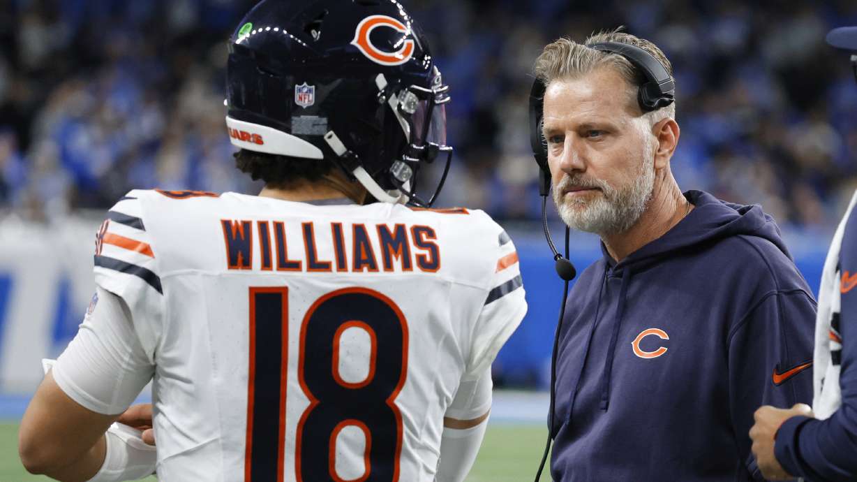 Chicago Bears quarterback Caleb Williams (18) talks with head coach Matt Eberflus during the second half of an NFL football game in Detroit, Thursday, Nov. 28, 2024.