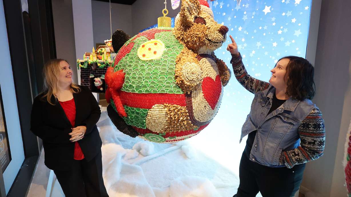 Artists Jennifer Vesper and Kym Vesper, mother and daughter, talk about their creation as Macy’s City Creek unveils candy window displays in Salt Lake City on Thursday.