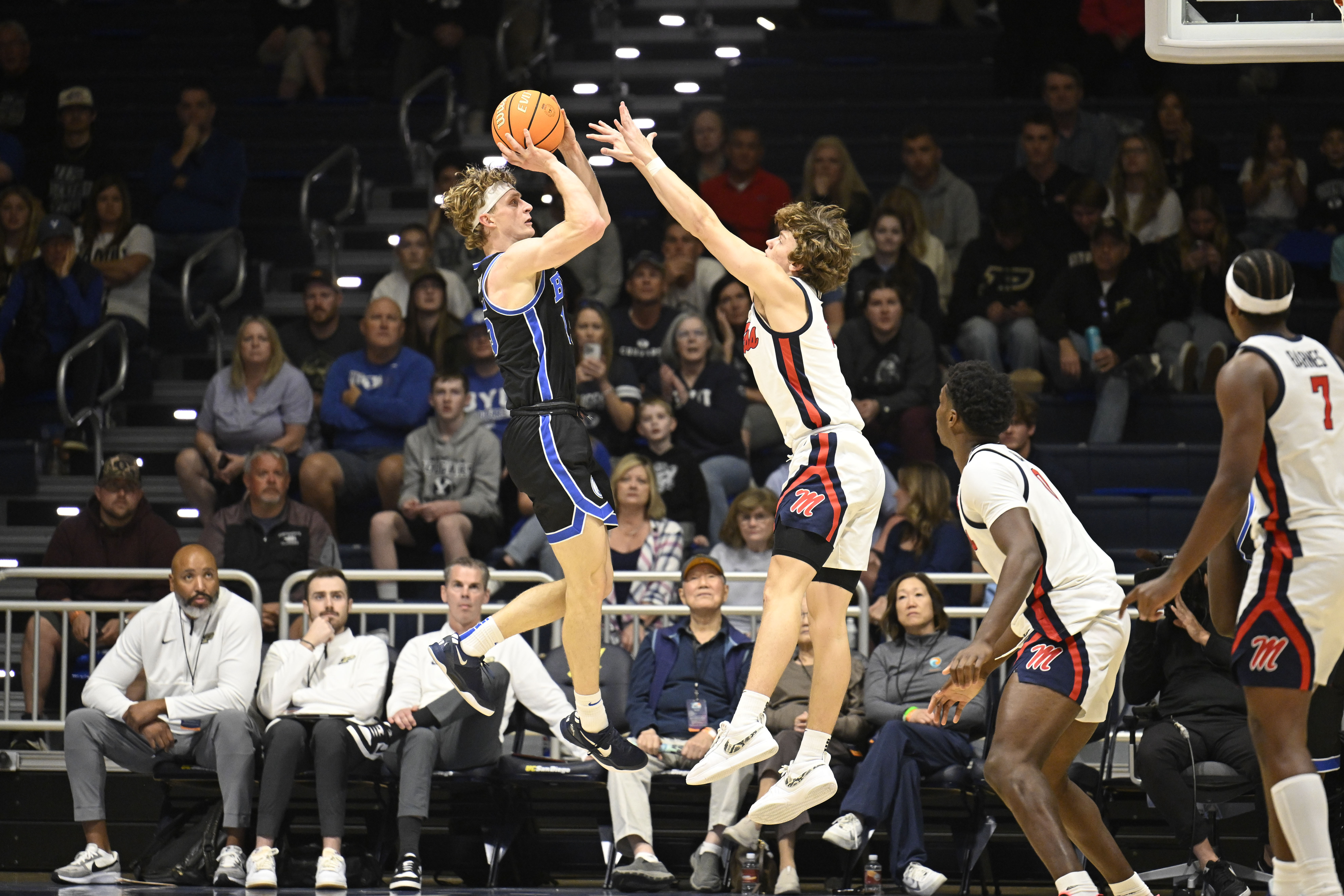 BYU forward Richie Saunders, front left, looks to shoot over Mississippi guard Eduardo Klafke, front second from left, during the second half of an NCAA college basketball game Thursday, Nov. 28, 2024, in San Diego.