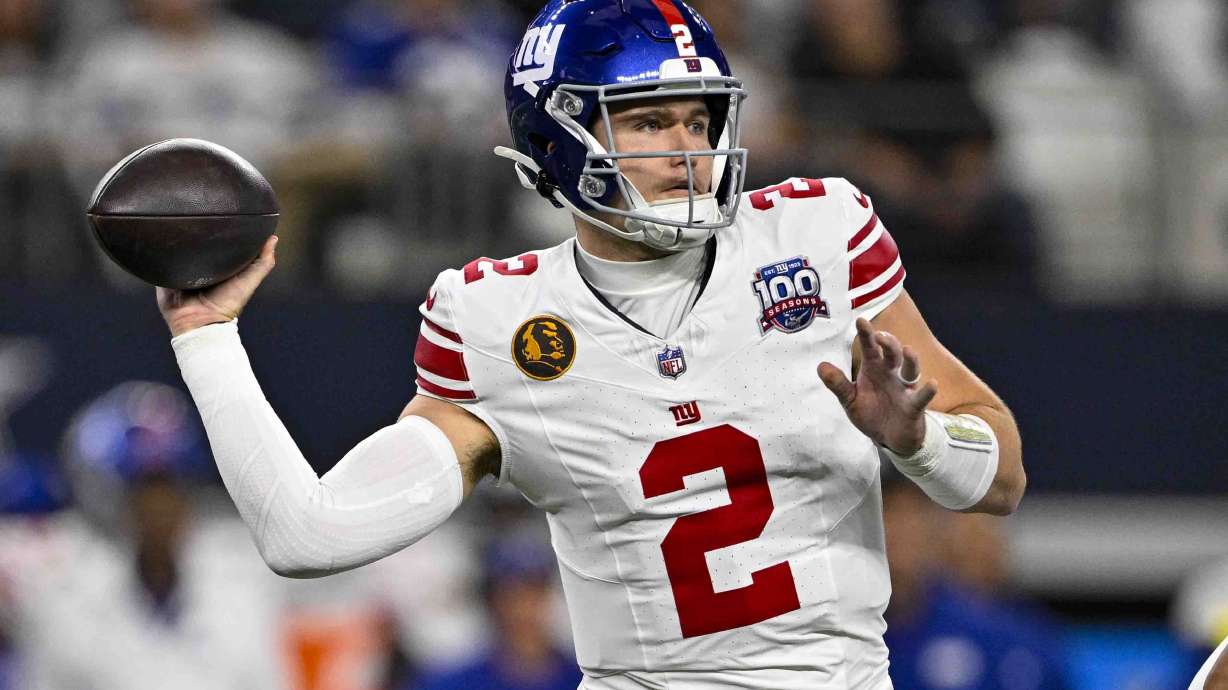 New York Giants quarterback Drew Lock (2) throws against the Dallas Cowboys during the first half of an NFL football game in Arlington, Texas, Thursday, Nov. 28, 2024.