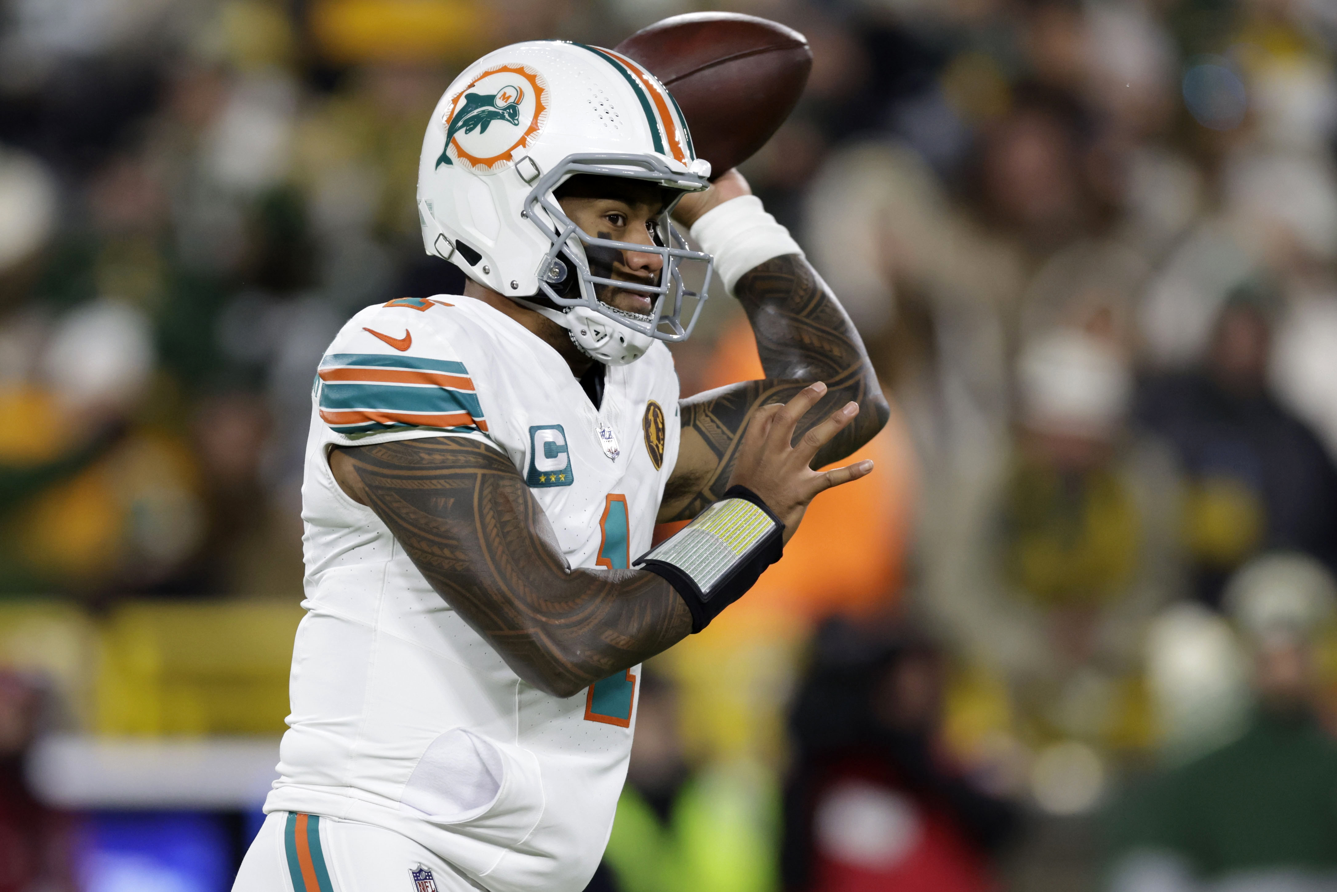 Miami Dolphins quarterback Tua Tagovailoa throws a pass during the first half of an NFL football game against the Green Bay Packers Thursday, Nov. 28, 2024, in Green Bay, Wis. 