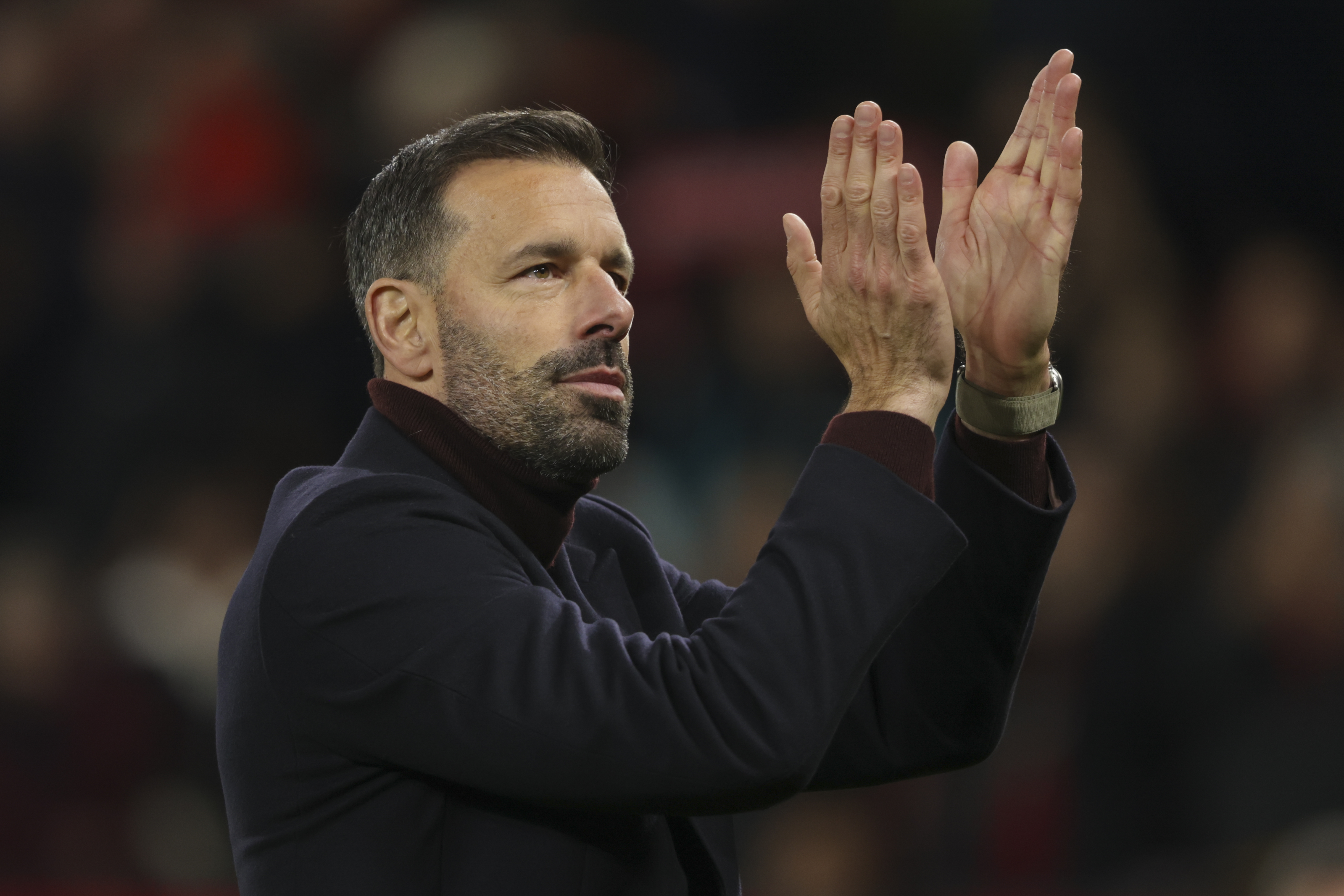 Manchester United's head coach Ruud van Nistelrooy applauds after the Premier League soccer match between Manchester United and Chelsea at Old Trafford stadium in Manchester, England, Sunday, Nov. 3, 2024.
