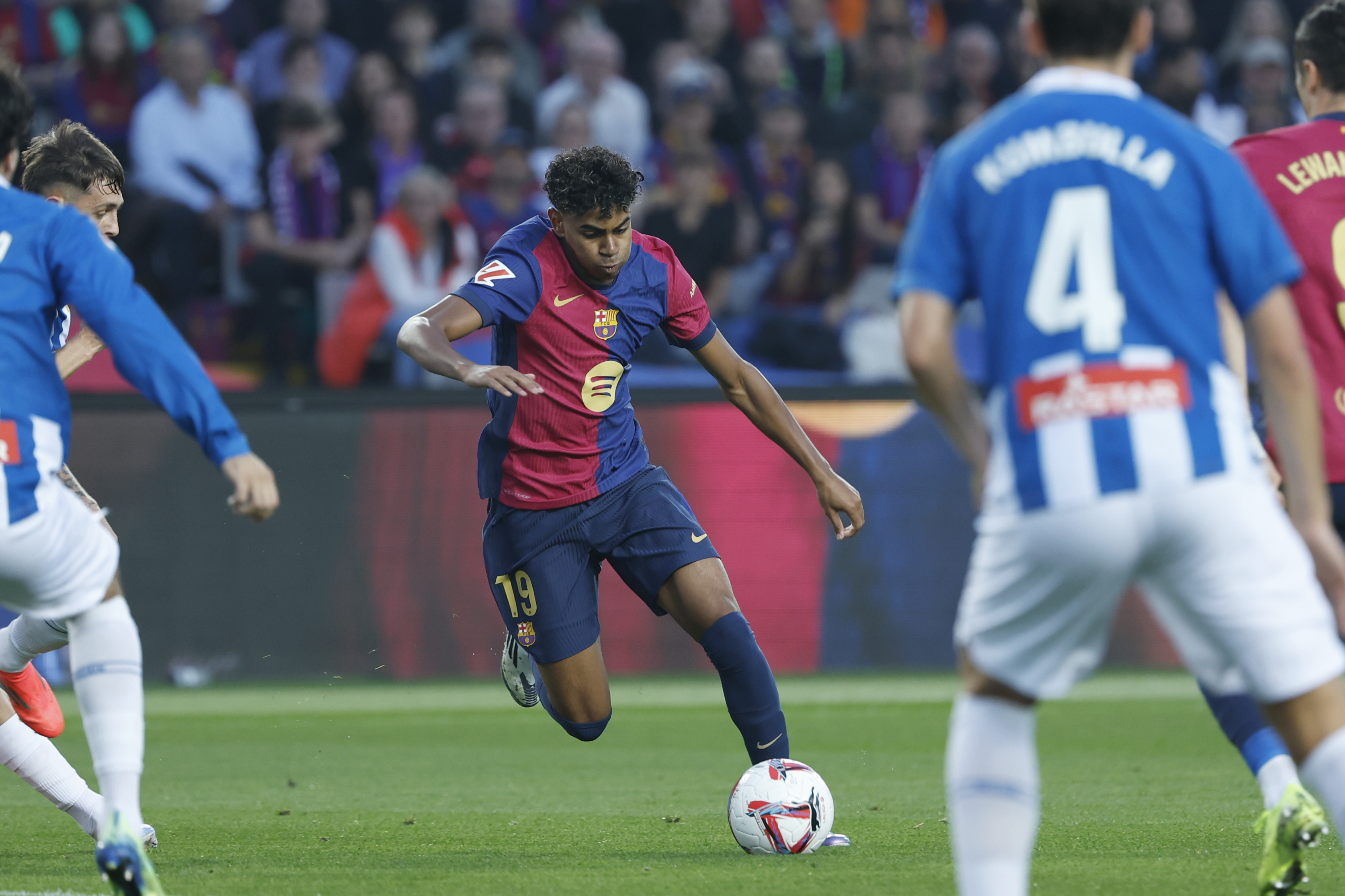 Barcelona's Lamine Yamal, centre, in action during a Spanish La Liga soccer match between Barcelona and Espanyol at the Lluis Companys Olympic Stadium in Barcelona, Spain, Sunday, Nov. 3, 2024. 