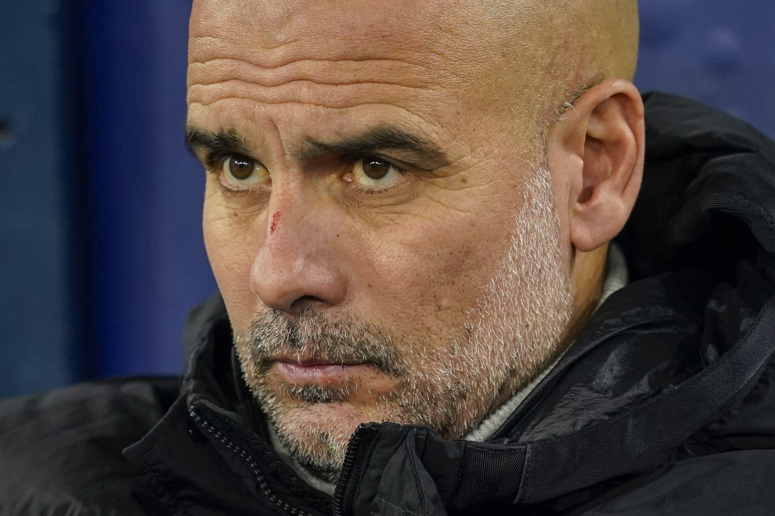 Manchester City's head coach Pep Guardiola takes his seat on the bench before the Champions League opening phase soccer match between Manchester City and Feyenoord at the Etihad Stadium in Manchester, England, Tuesday, Nov. 26, 2024. 