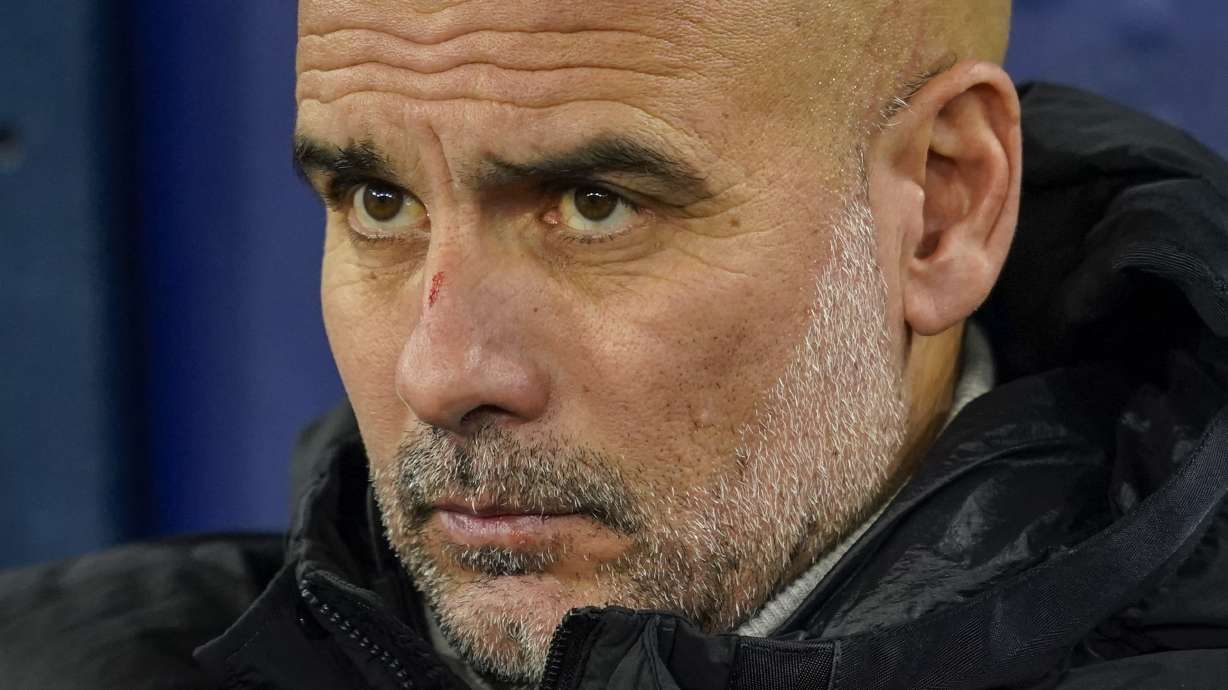 Manchester City's head coach Pep Guardiola takes his seat on the bench before the Champions League opening phase soccer match between Manchester City and Feyenoord at the Etihad Stadium in Manchester, England, Tuesday, Nov. 26, 2024.