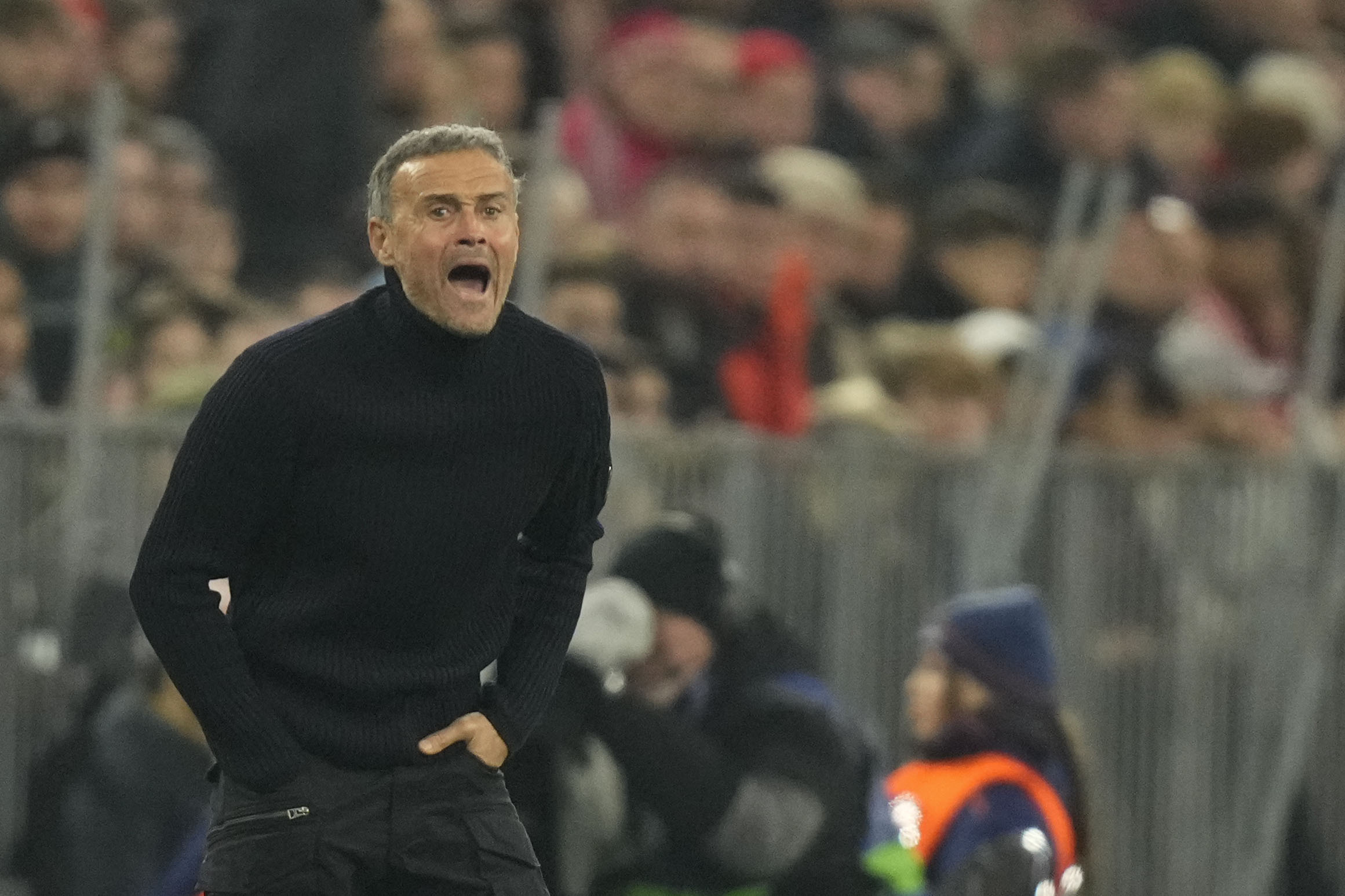 PSG's head coach Luis Enrique gives instructions to his players during the Champions League opening phase soccer match between FC Bayern and Paris Saint Germain, at the Allianz Arena in Munich, Germany, Tuesday, Nov. 26, 2024.