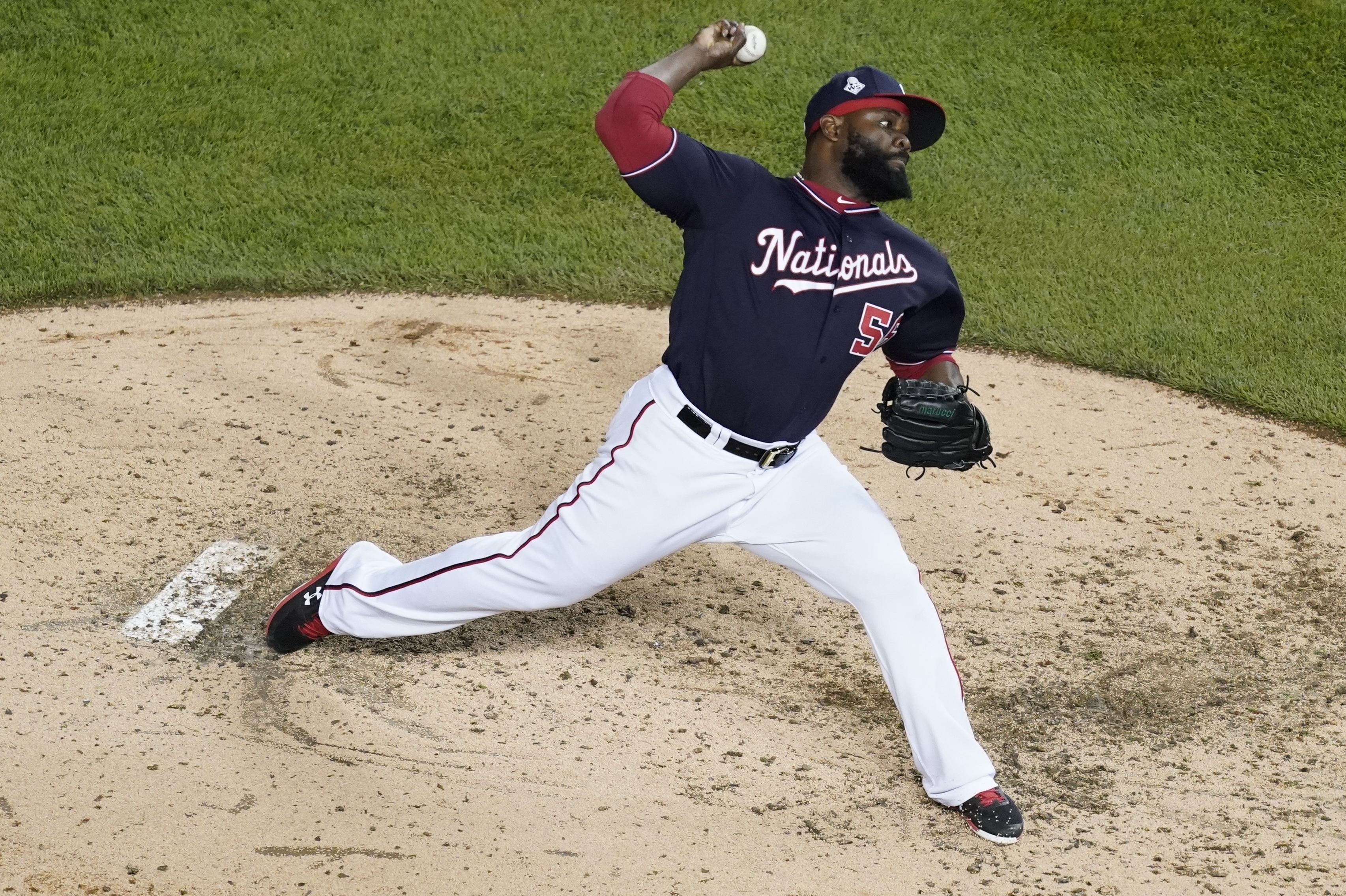 FILE - Washington Nationals relief pitcher Fernando Rodney throws during the sixth inning of Game 3 of the baseball World Series against the Houston Astros Friday, Oct. 25, 2019, in Washington.