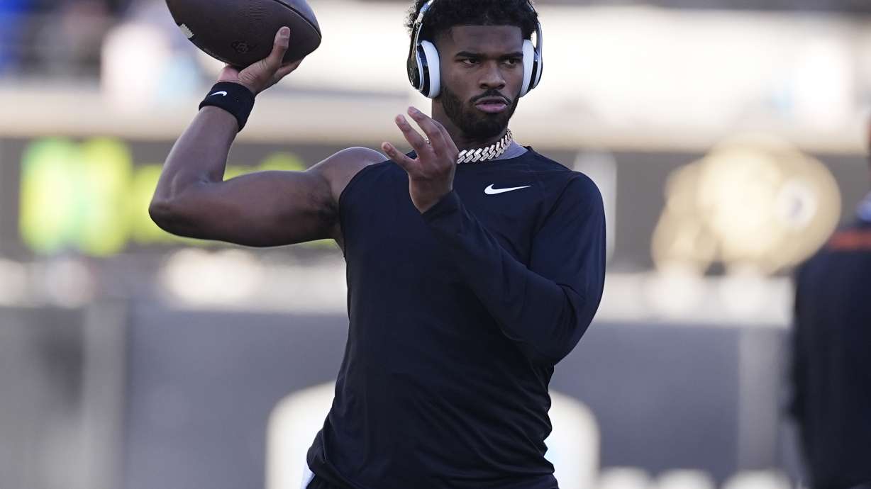Colorado quarterback Shedeur Sanders warms up before an NCAA college football game against Oklahoma State Friday, Nov. 29, 2024, in Boulder, Colo.