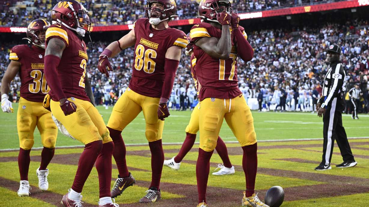Washington Commanders wide receiver Terry McLaurin (17) celebrates after scoring an 86-yard touchdown during the second half of an NFL football game against the Dallas Cowboys, Sunday, Nov. 24, 2024, in Landover, Md.