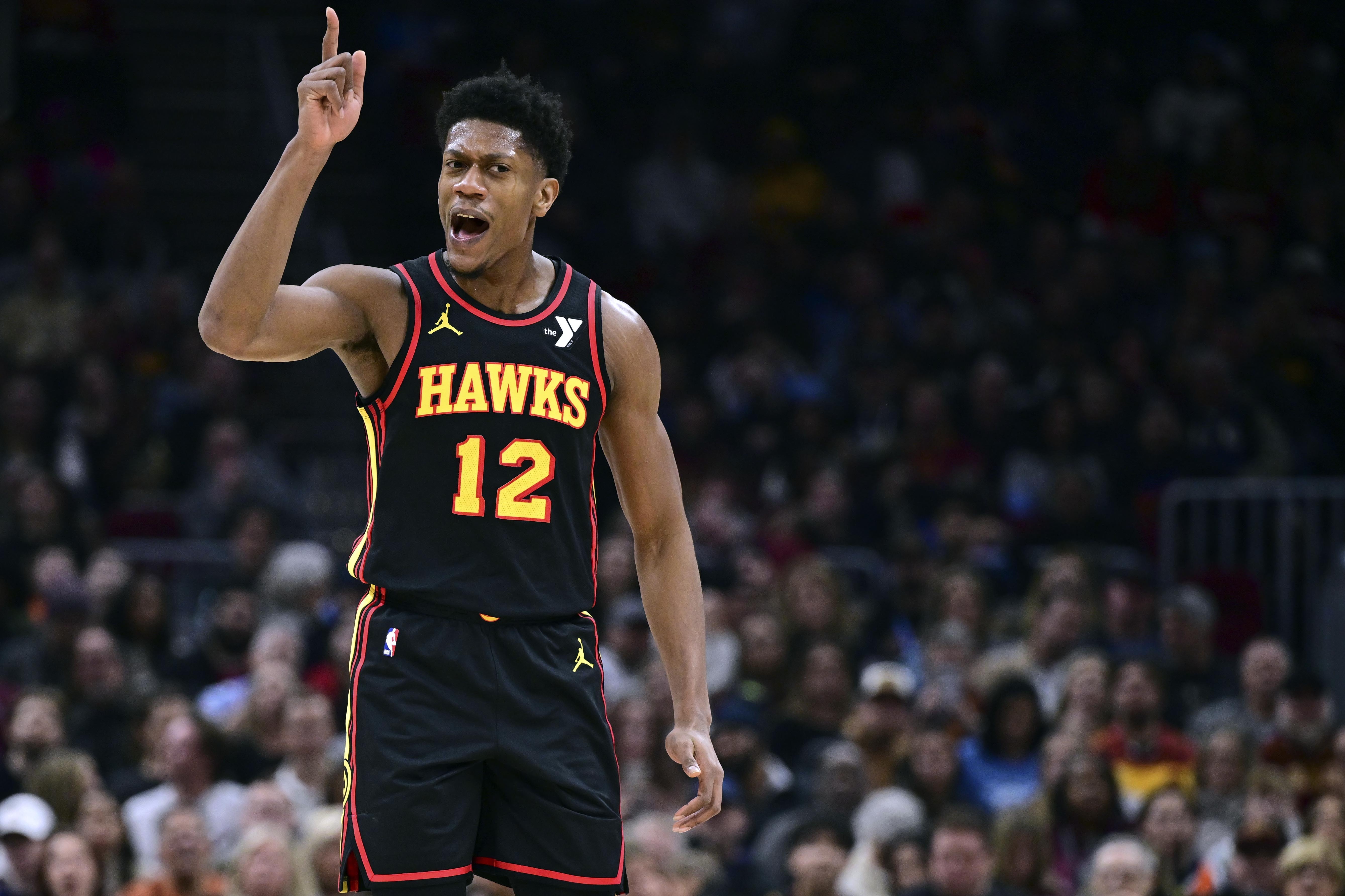 Atlanta Hawks forward De'Andre Hunter reacts after making a basket in the first half of an NBA basketball game against the Cleveland Cavaliers, Wednesday, Nov. 27, 2024, in Cleveland. 