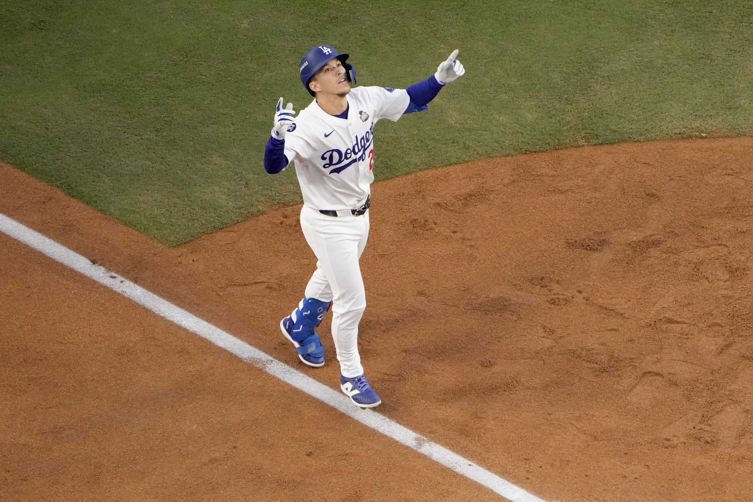 FILE - Los Angeles Dodgers' Tommy Edman celebrates as he reaches home plate after his solo home run during the second inning in Game 2 of the baseball World Series against the New York Yankees, Oct. 26, 2024, in Los Angeles.
