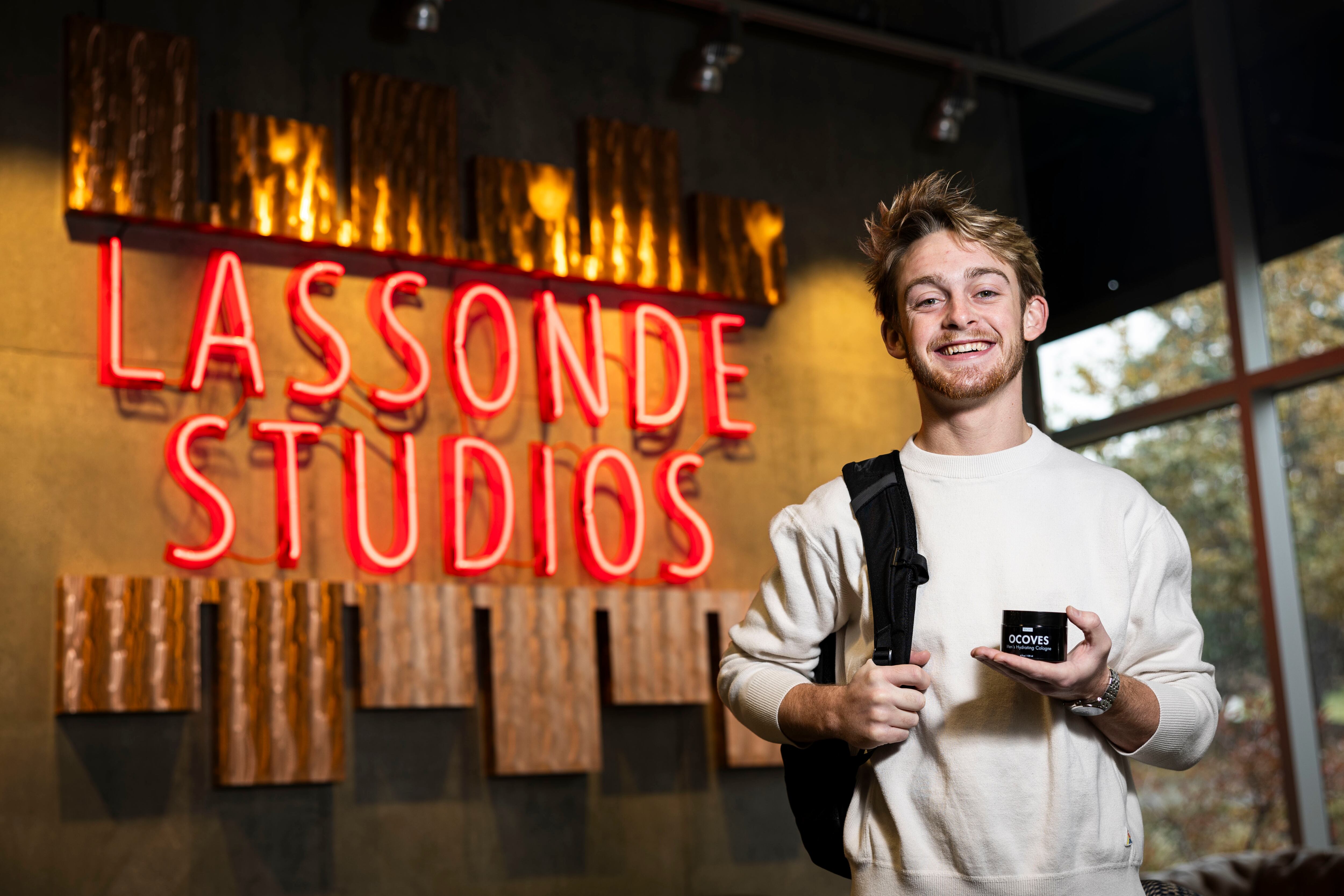 Ethan McQuarrie, a junior studying entrepreneurship, poses with his product, OCOVES Men’s Hydrating Cologne, at Lassonde Studios of the Lassonde Entrepreneur Institute on the campus of the University of Utah in Salt Lake City on Nov. 16. The cologne comes in two scents: sea salt and pine.