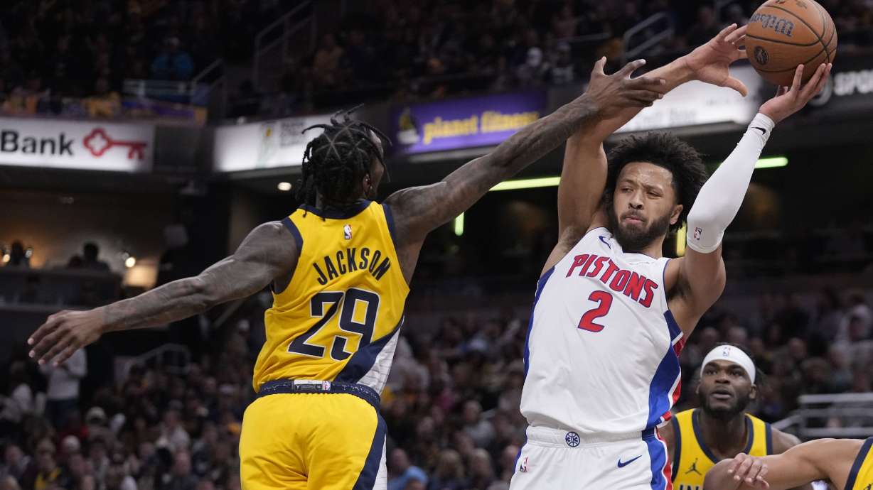 Detroit Pistons' Cade Cunningham (2) is fouled by Indiana Pacers' Quenton Jackson (29) during the first half of an Emirates NBA Cup basketball game, Friday, Nov. 29, 2024, in Indianapolis.