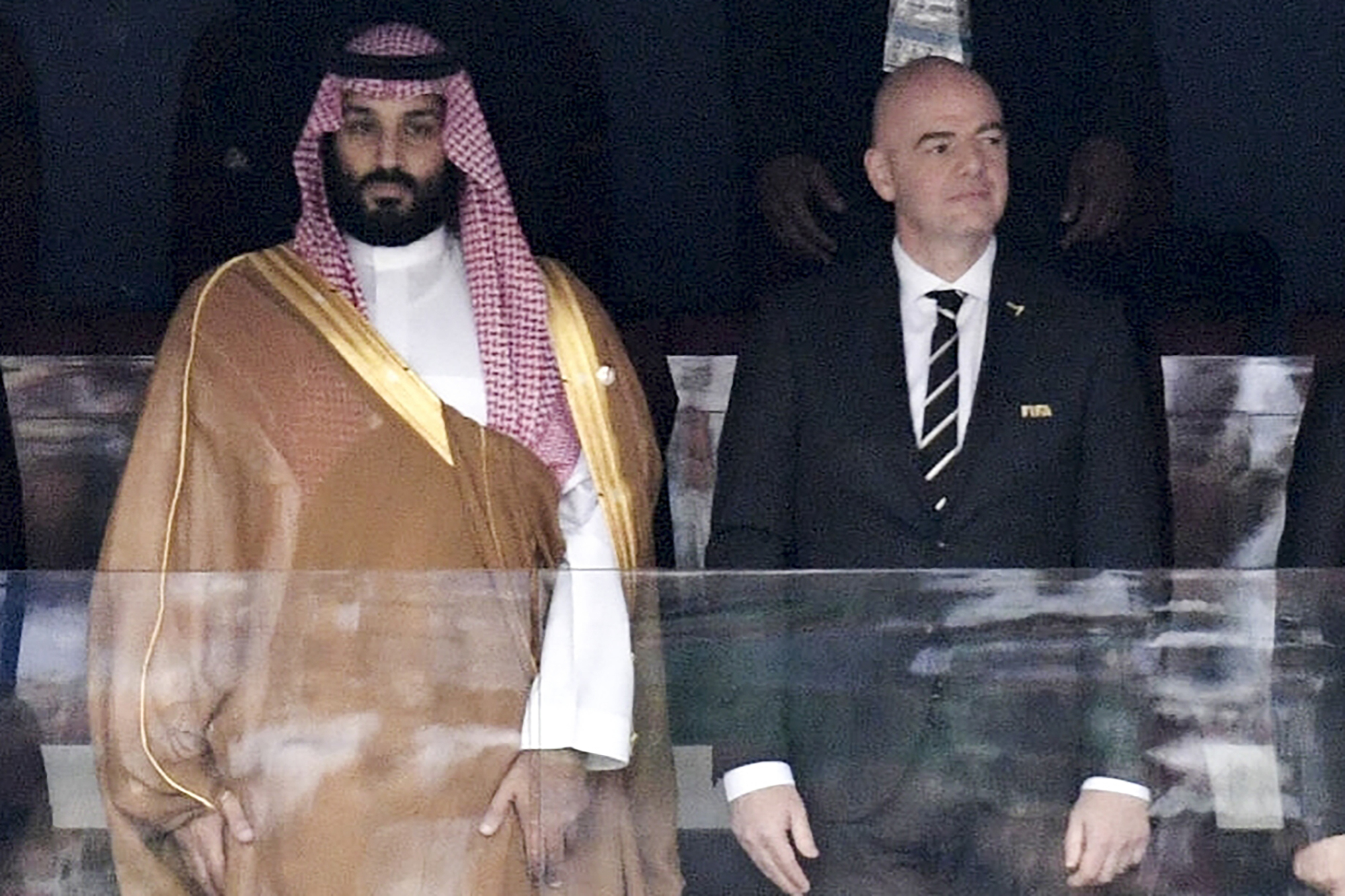 FILE - Saudi Arabia Crown Prince Mohammed bin Salman, left, and FIFA President Gianni Infantino, stand for the anthem prior to the match between Russia and Saudi Arabia which opened the 2018 soccer World Cup at the Luzhniki stadium in Moscow, Russia, on June 14, 2018. 