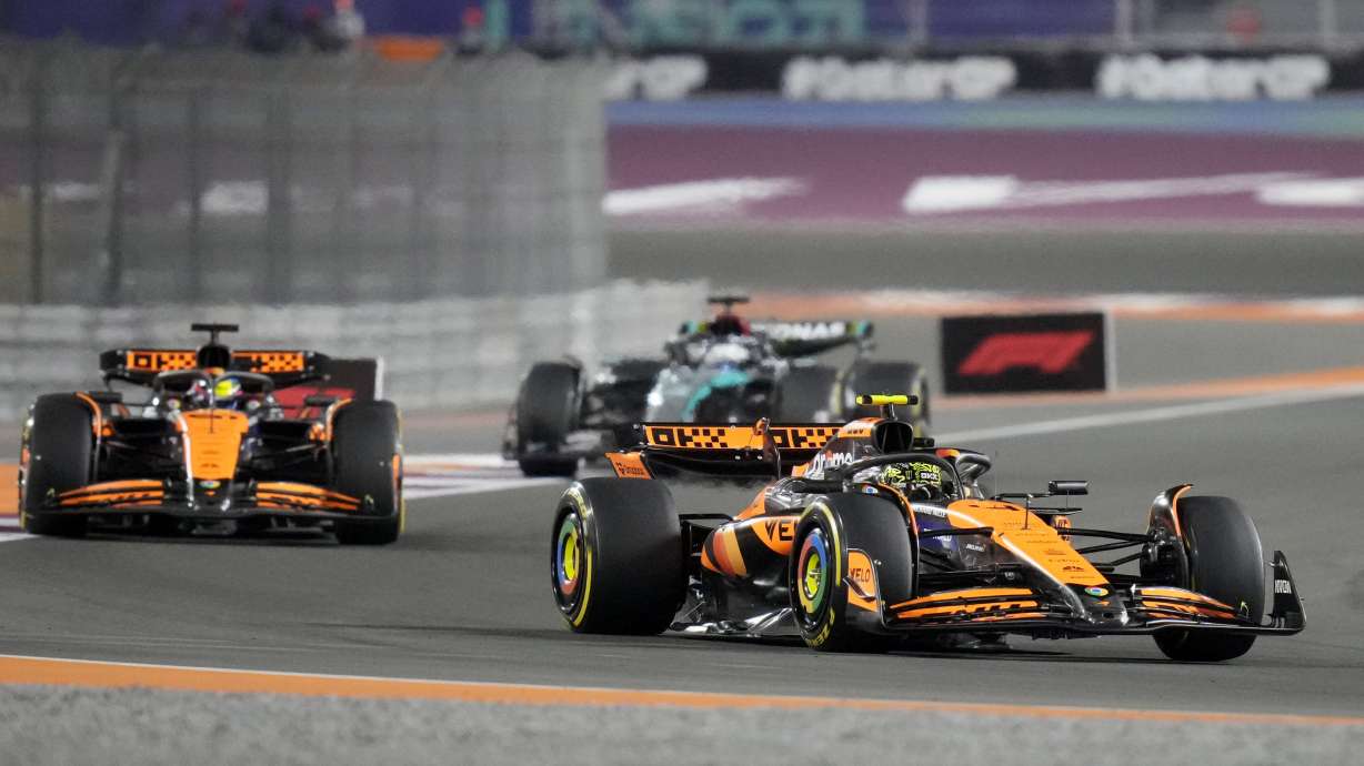McLaren driver Lando Norris of Britain leads his teammate McLaren driver Oscar Piastri of Australia during sprint race at the Formula One Qatar Grand Prix, at the Lusail International Circuit in Lusail, Qatar, Saturday, Nov. 30, 2024.