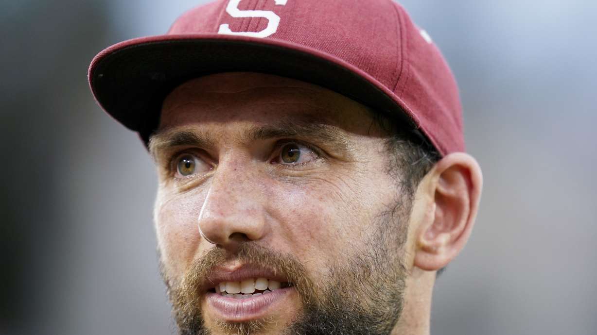 FILE - Former Stanford quarterback Andrew Luck stands on the sideline during the second half of an NCAA college football game against Southern California in Stanford, Calif., Saturday, Sept. 10, 2022.