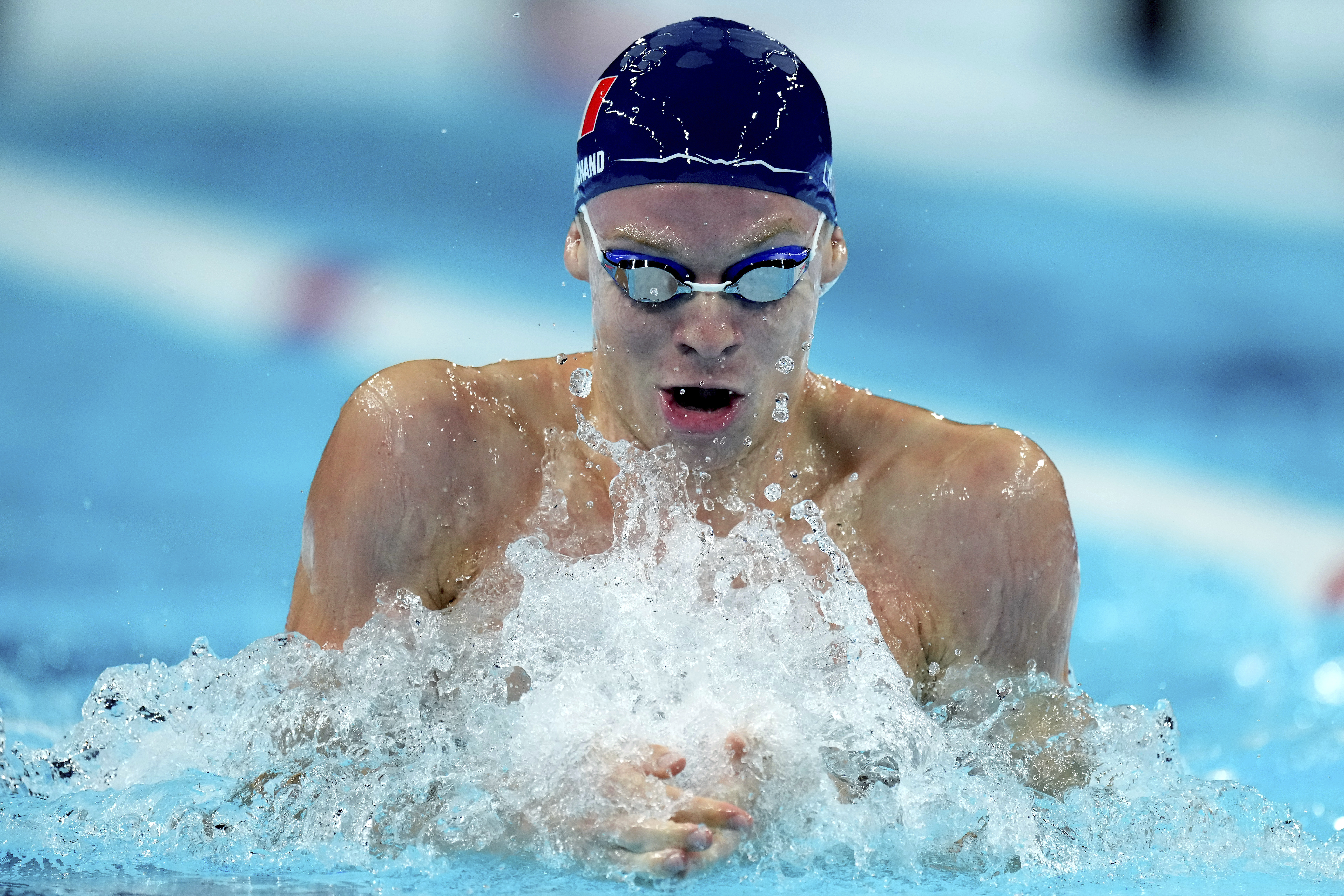 FILE - Leon Marchand from France competes in a men's 4x100-meter medley relay heat at the Summer Olympics in Nanterre, France, Saturday, Aug. 3, 2024.