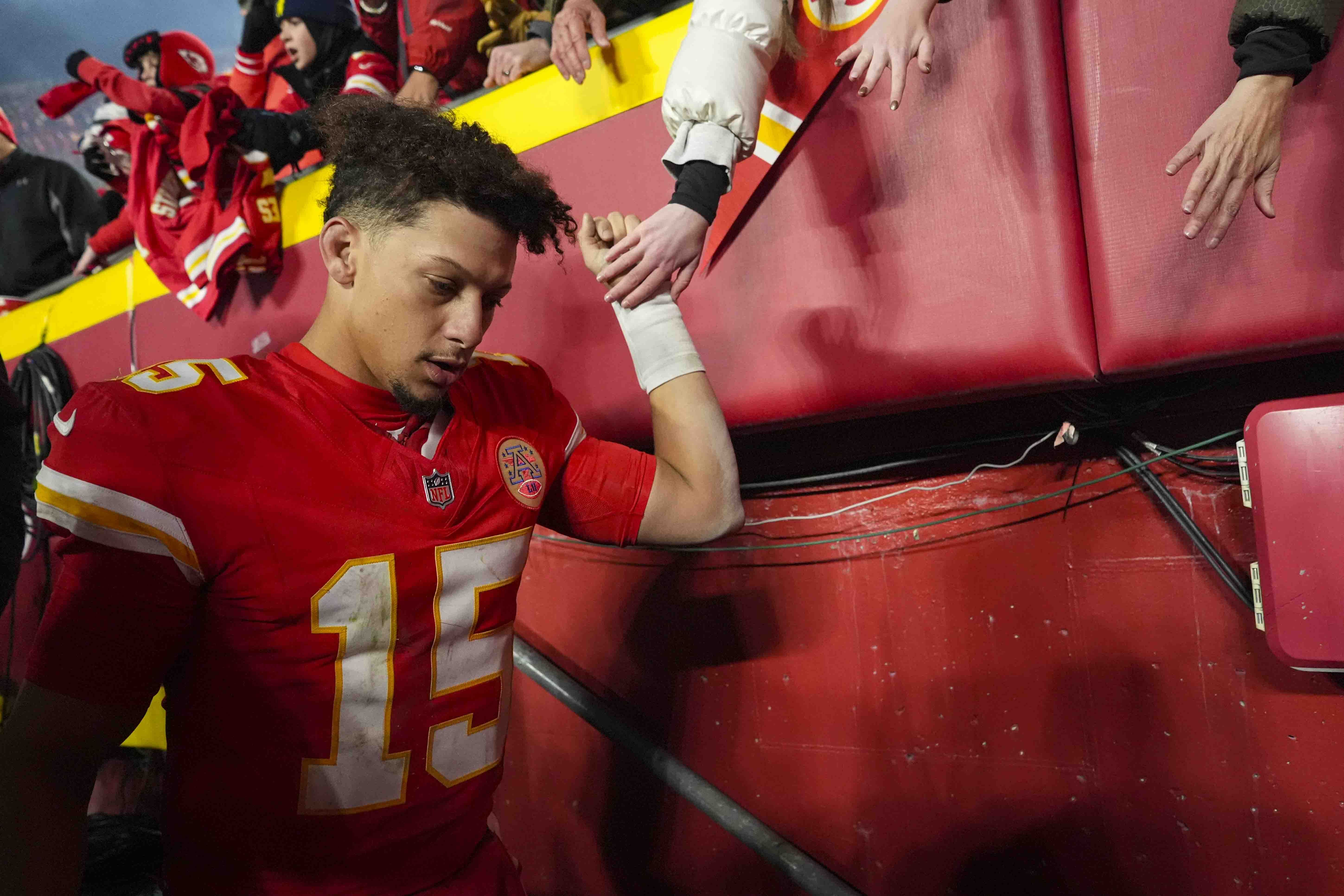 Kansas City Chiefs quarterback Patrick Mahomes (15) greets fan following an NFL football game against the Las Vegas Raiders in Kansas City, Mo., Friday, Nov. 29, 2024.