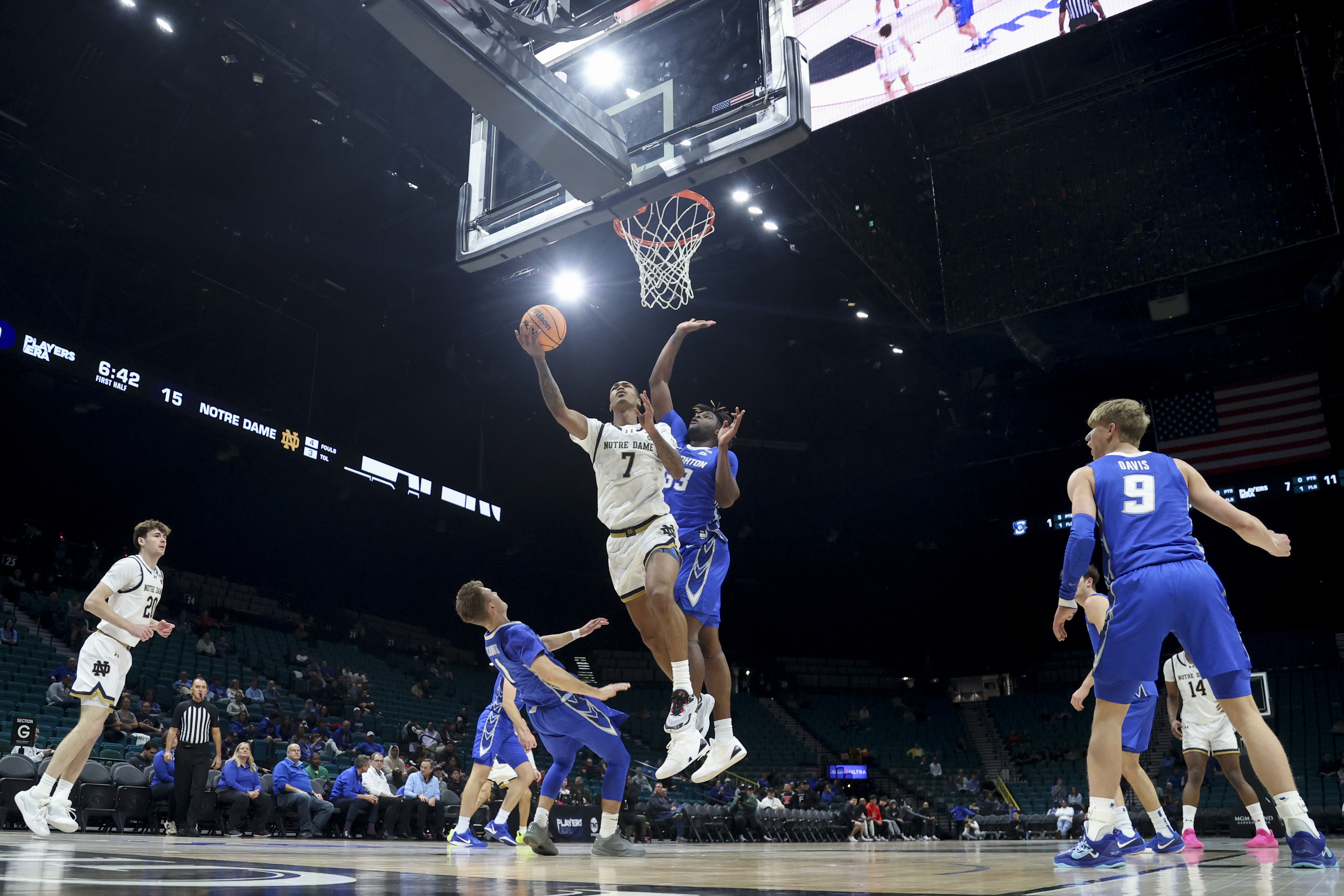 Notre Dame forward Tae Davis (7) shoots against Creighton guard Steven Ashworth (1) and center Fredrick King (33) during the first half of an NCAA college basketball game Saturday, Nov. 30, 2024, in Las Vegas. 