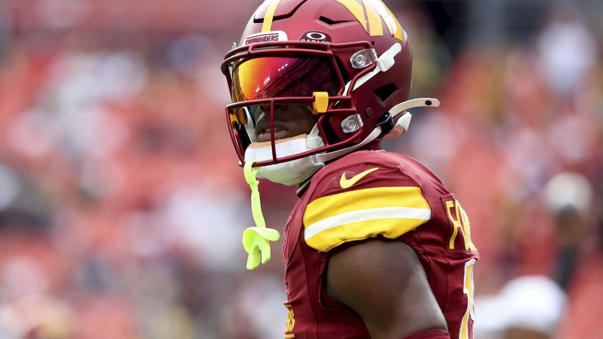 FILE - Washington Commanders cornerback Emmanuel Forbes Jr. (13) warms up before an NFL football game against the Pittsburgh Steelers, Nov. 10, 2024, in Landover, Md.