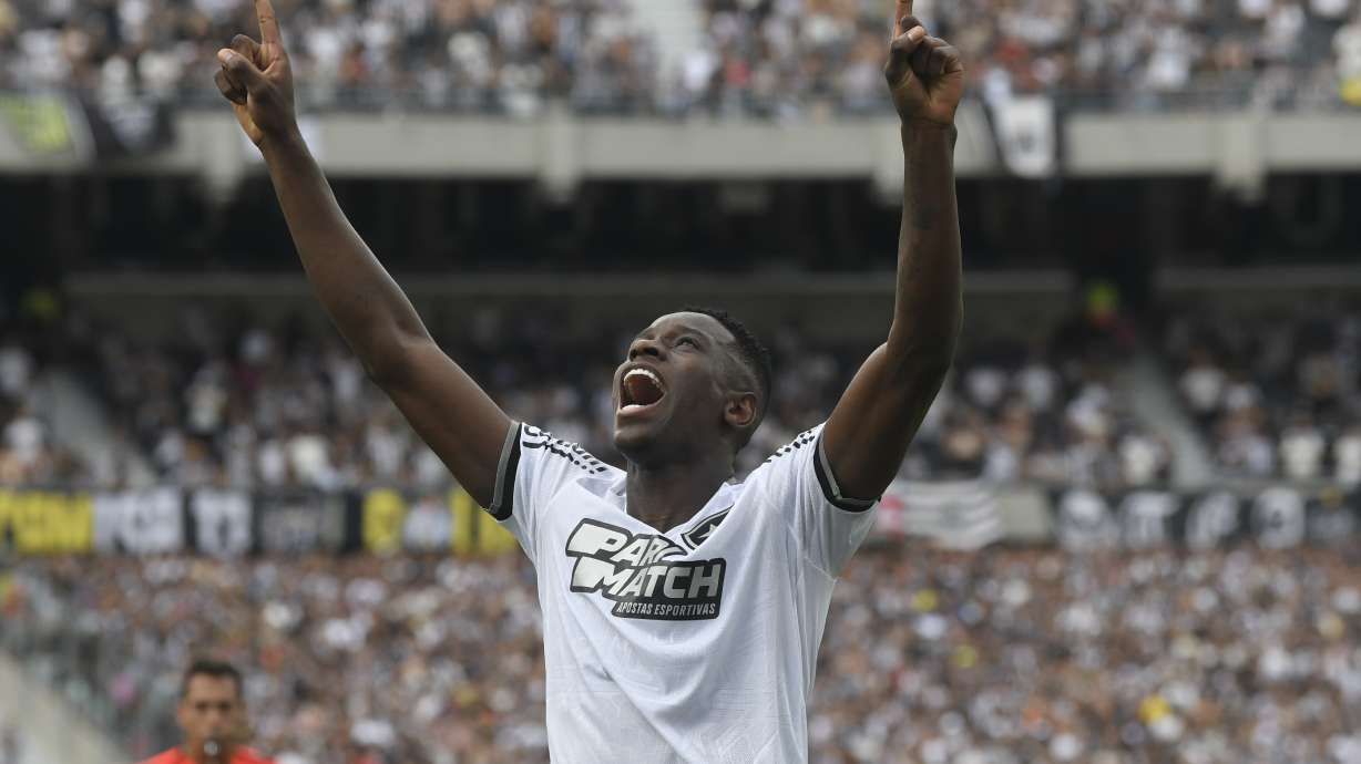 Luiz Henrique of Brazil's Botafogo celebrates after scoring his side's opening goal against Brazil's Atletico Mineiro during a Copa Libertadores final soccer match at Monumental stadium in Buenos Aires, Argentina, Saturday, Nov. 30, 2024.