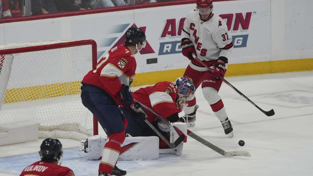 Florida Panthers goaltender Spencer Knight (30) stops a shot by Carolina Hurricanes right wing Andrei Svechnikov (37) during the second period of an NHL hockey game, Saturday, Nov. 30, 2024, in Sunrise, Fla.