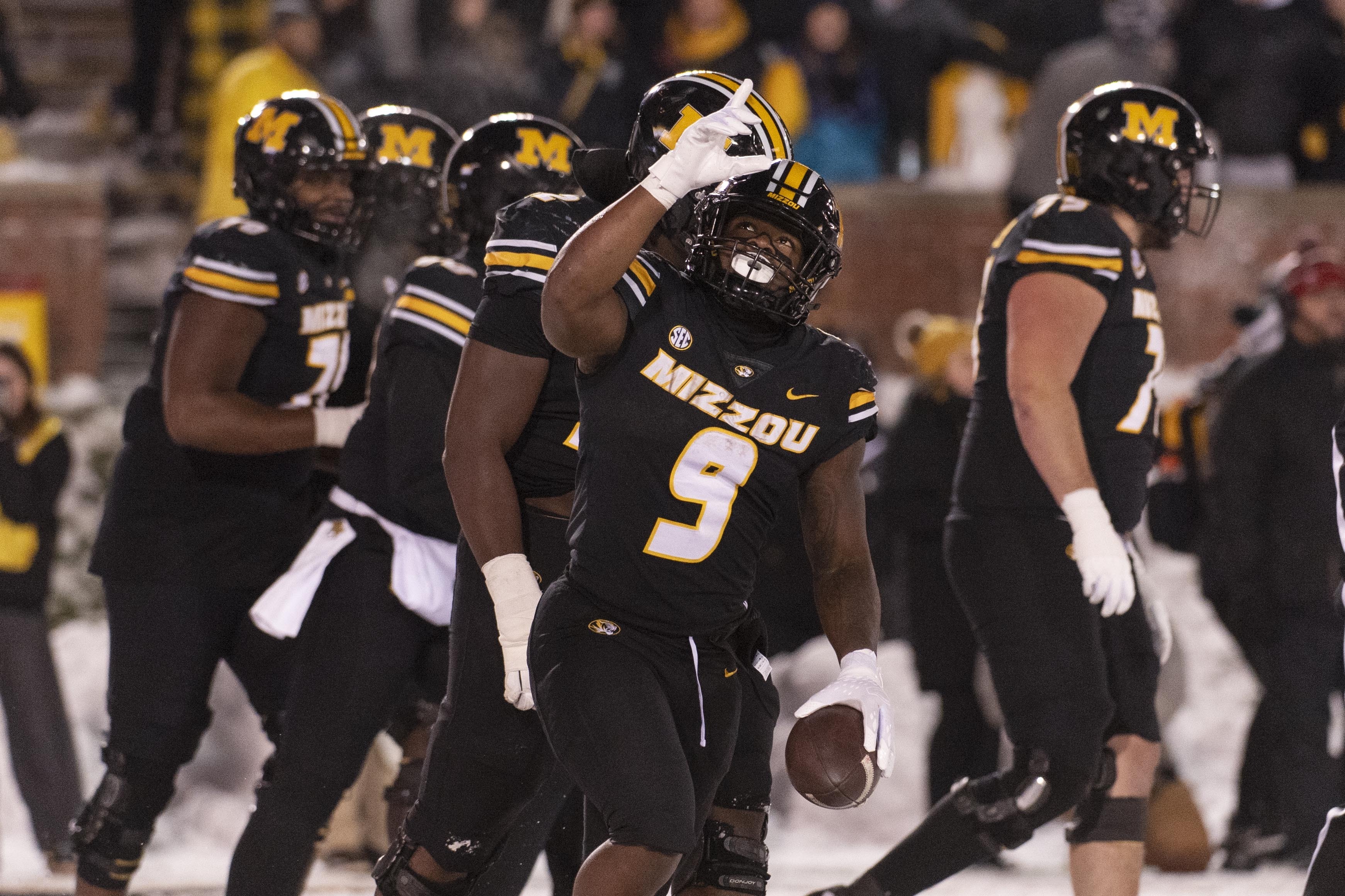 Missouri running back Marcus Carroll (9) celebrates after a touchdown during the second half of an NCAA college football game against Arkansas, Saturday, Nov. 30, 2024, in Columbia, Mo. 