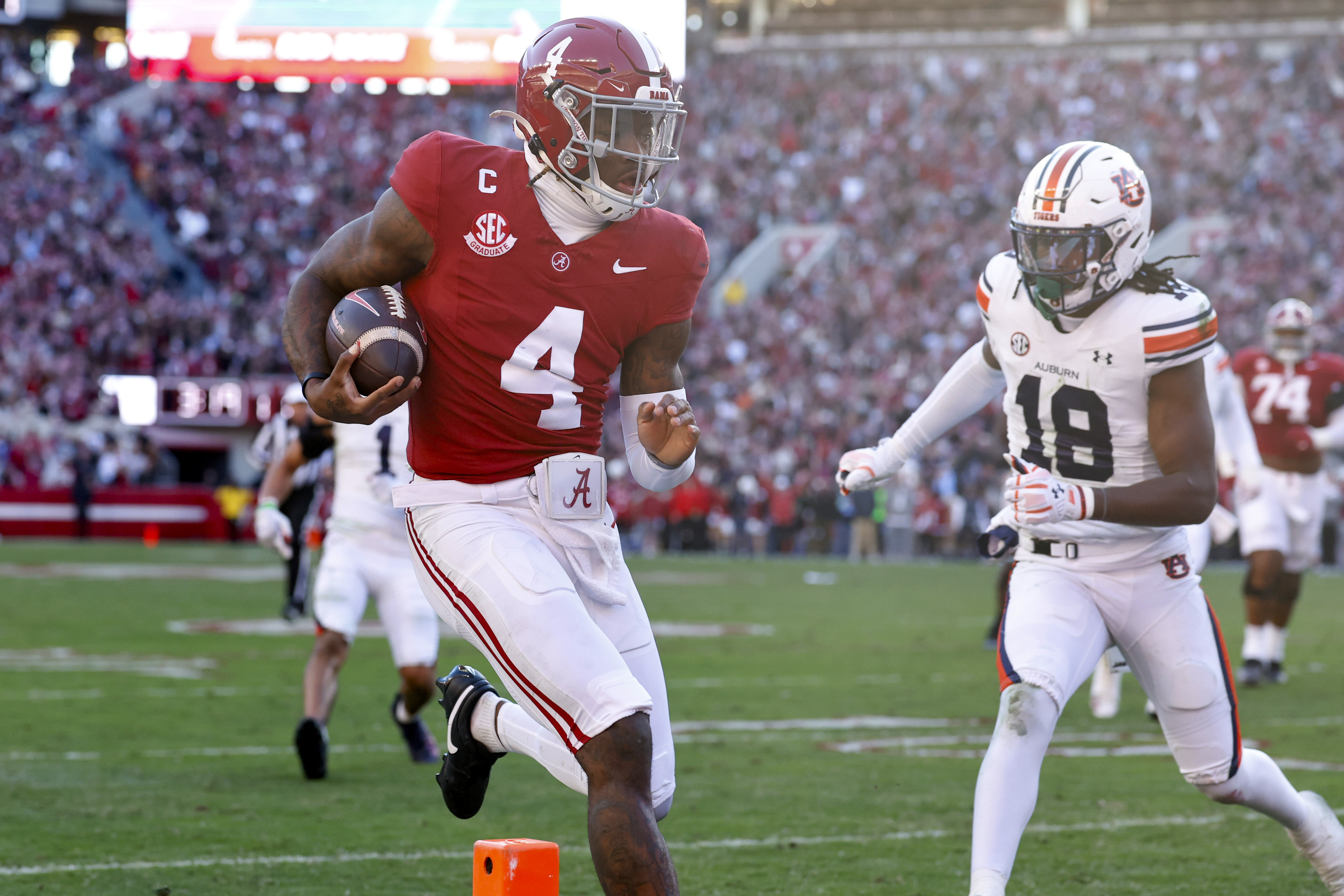 Milroe, No. 13 Alabama keep playoff hopes alive with 28-14 win over Auburn in the Iron Bowl