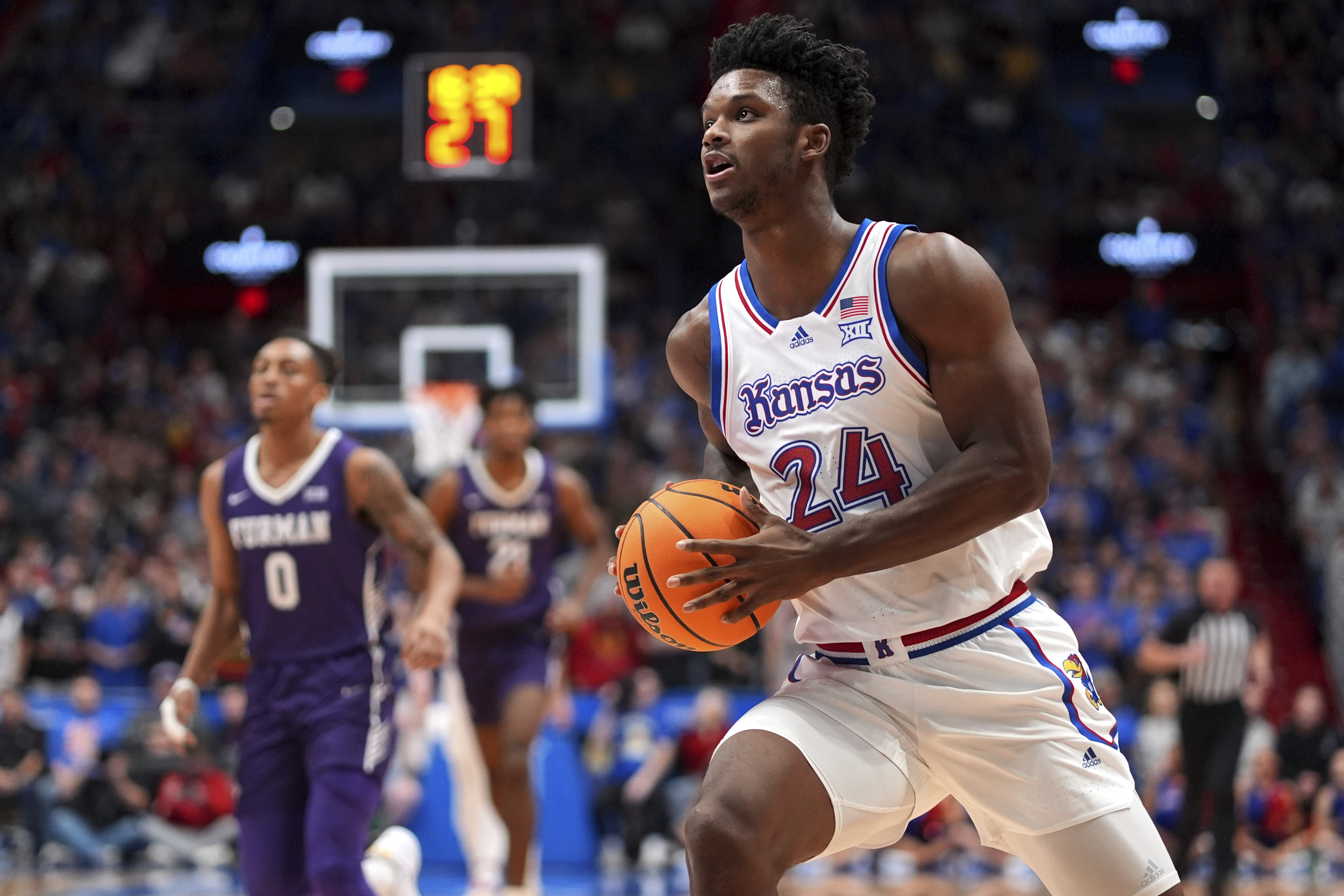 Kansas forward KJ Adams Jr. (24) looks to shoot during the first half of an NCAA college basketball game against Furman, Saturday, Nov. 30, 2024, in Lawrence, Kan. 