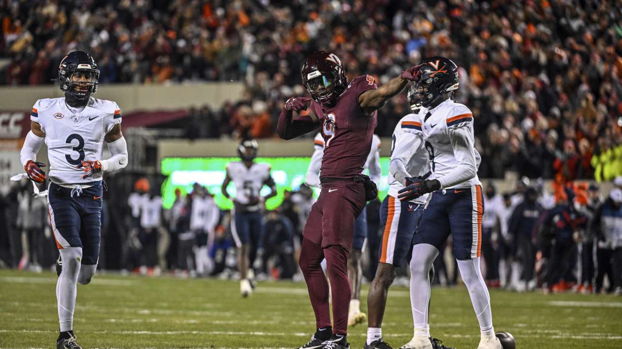 Virginia Tech's Da'Quan Felton, center right, reacts after getting a first down against Virginia during the first half of an NCAA college football game Saturday, Nov. 30, 2024, in Blacksburg, Va.
