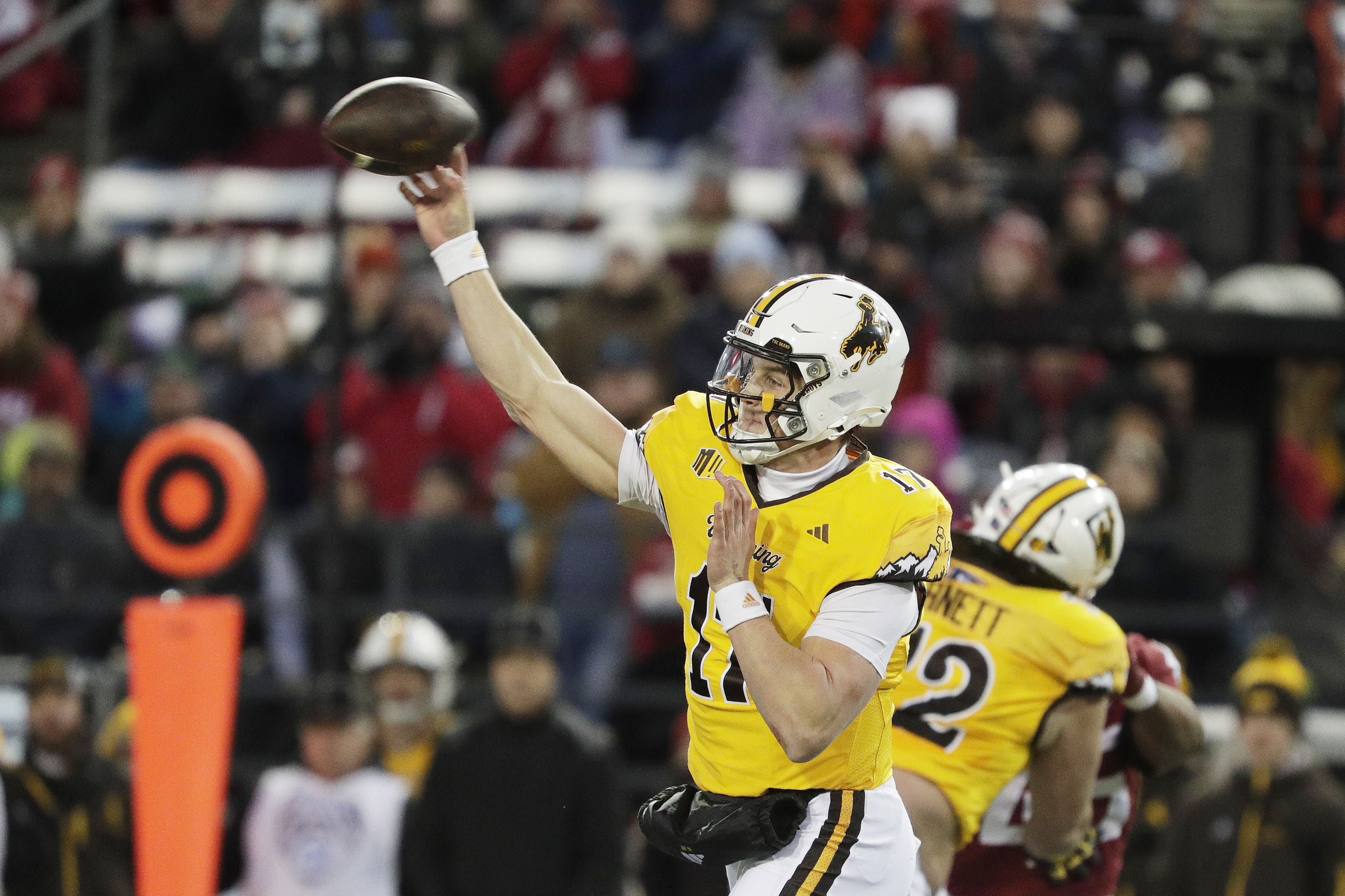 Wyoming quarterback Evan Svoboda (17) throws a pass during the first half of an NCAA college football game against Washington State, Saturday, Nov. 30, 2024, in Pullman, Wash. 