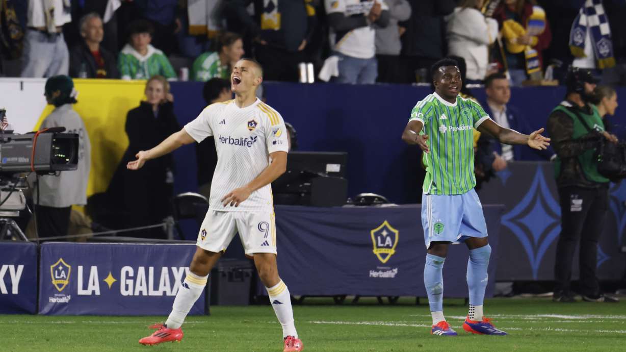 Los Angeles Galaxy forward Dejan Joveljic, left, celebrates after scoring during the second half of an MLS Western Conference final soccer match against the Seattle Sounders, Saturday, Nov. 30, 2024, in Carson, Calif.