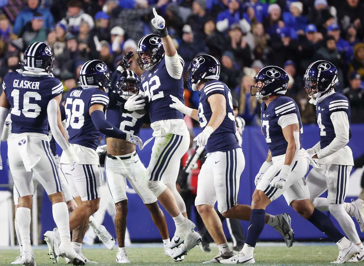 Brigham Young defensive end Tyler Batty (92) celebrates his interception against the Houston Cougars in Provo on Saturday, Nov. 30, 2024.