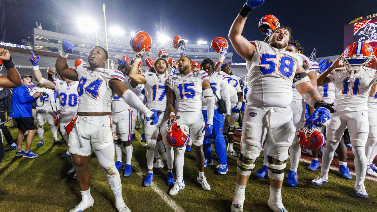 Florida players celebrate after defeating Florida State 31-11 after a NCAA college football game Saturday, Nov. 30, 2024, in Tallahassee, Fla.