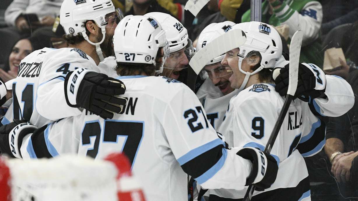 The Utah Hockey Club celebrates their fourth goal against the Vegas Golden Knights during the first period of an NHL hockey game Saturday, Nov. 30, 2024, in Las Vegas.
