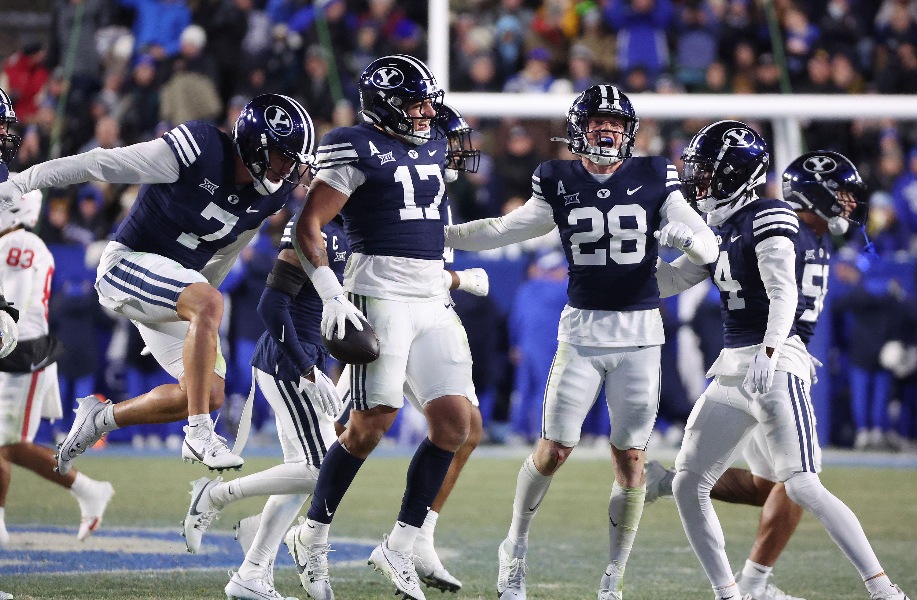 Brigham Young linebacker Jack Kelly (17) celebrates his interception against the Houston Cougars in Provo on Saturday, Nov. 30, 2024. BYU won 30-18.