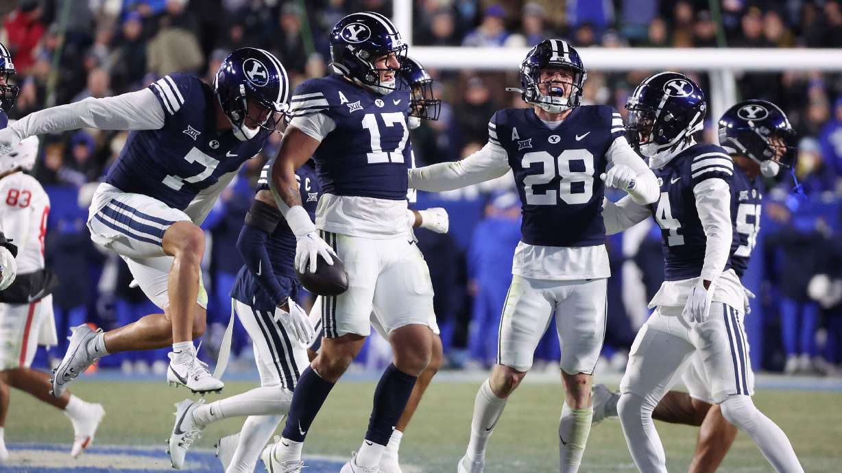 Brigham Young Cougars linebacker Jack Kelly (17) celebrates his interception against the Houston Cougars in Provo on Saturday, Nov. 30, 2024. BYU won 30-18.