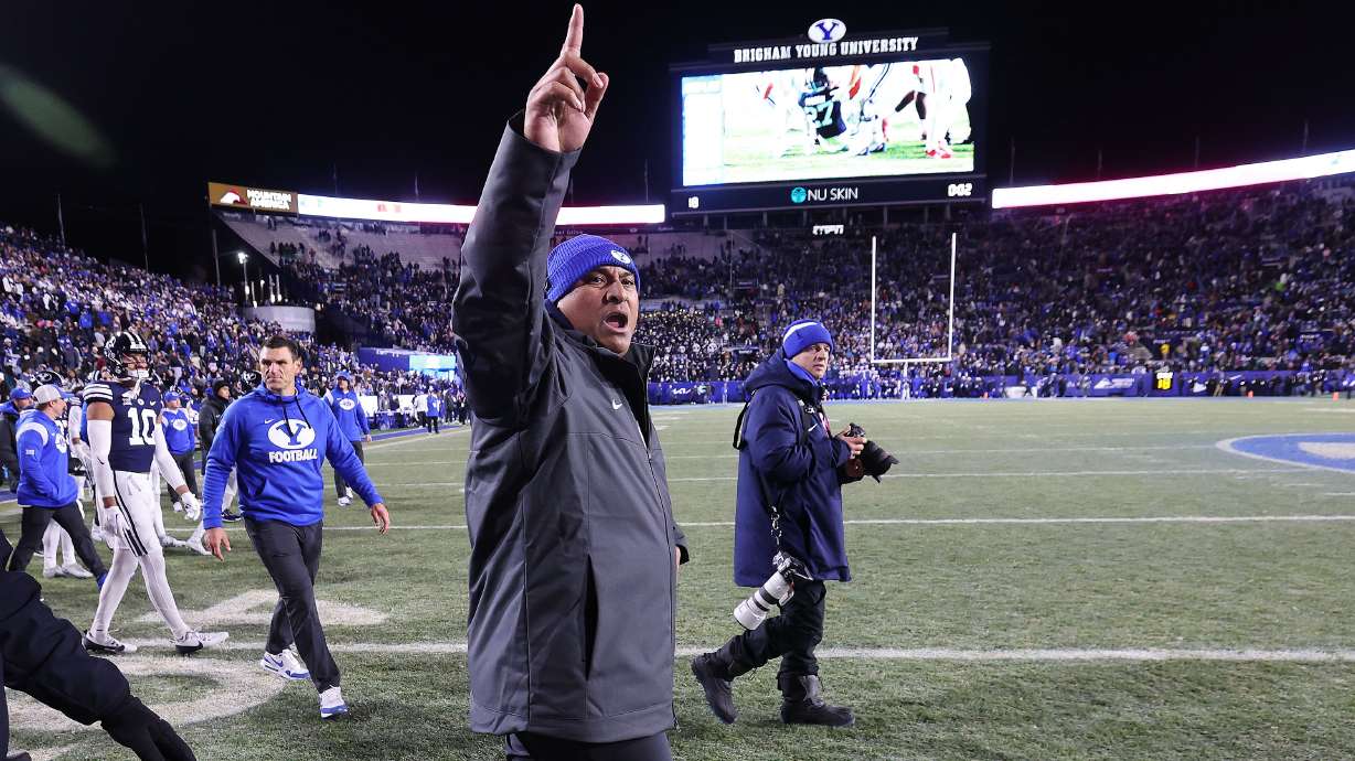Brigham Young Cougars head coach Kalani Sitake celebrates the win over the Houston Cougars in Provo on Saturday, Nov. 30, 2024. BYU won 30-18.