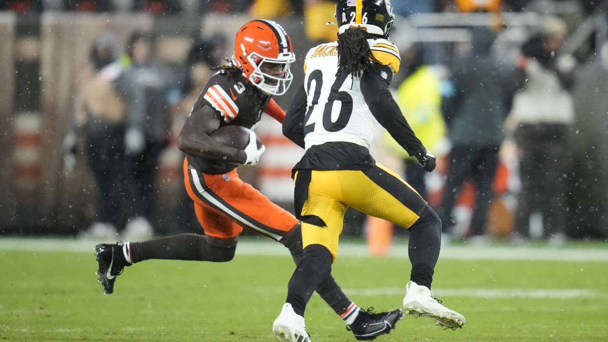 Cleveland Browns wide receiver Jerry Jeudy (3) carries against Pittsburgh Steelers cornerback Donte Jackson (26) in the first half of an NFL football game, Thursday, Nov. 21, 2024, in Cleveland.